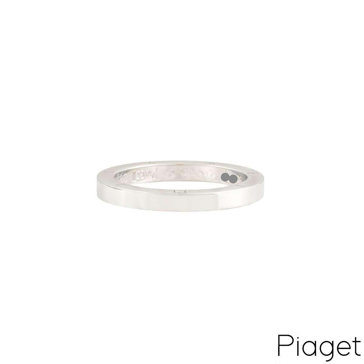 A diamond set wedding band by Piaget. The band has a smooth polished finish to the front, complemented with a single round brilliant cut diamond and Piaget logo engraved to one side of the outer edge. The ring is 2.5mm wide and is a size UK N - EU