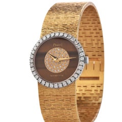 PIAGET Diamant-Uhr mit Tigerauge-Zifferblatt und Diamant-Lünette aus 18 Karat Gold