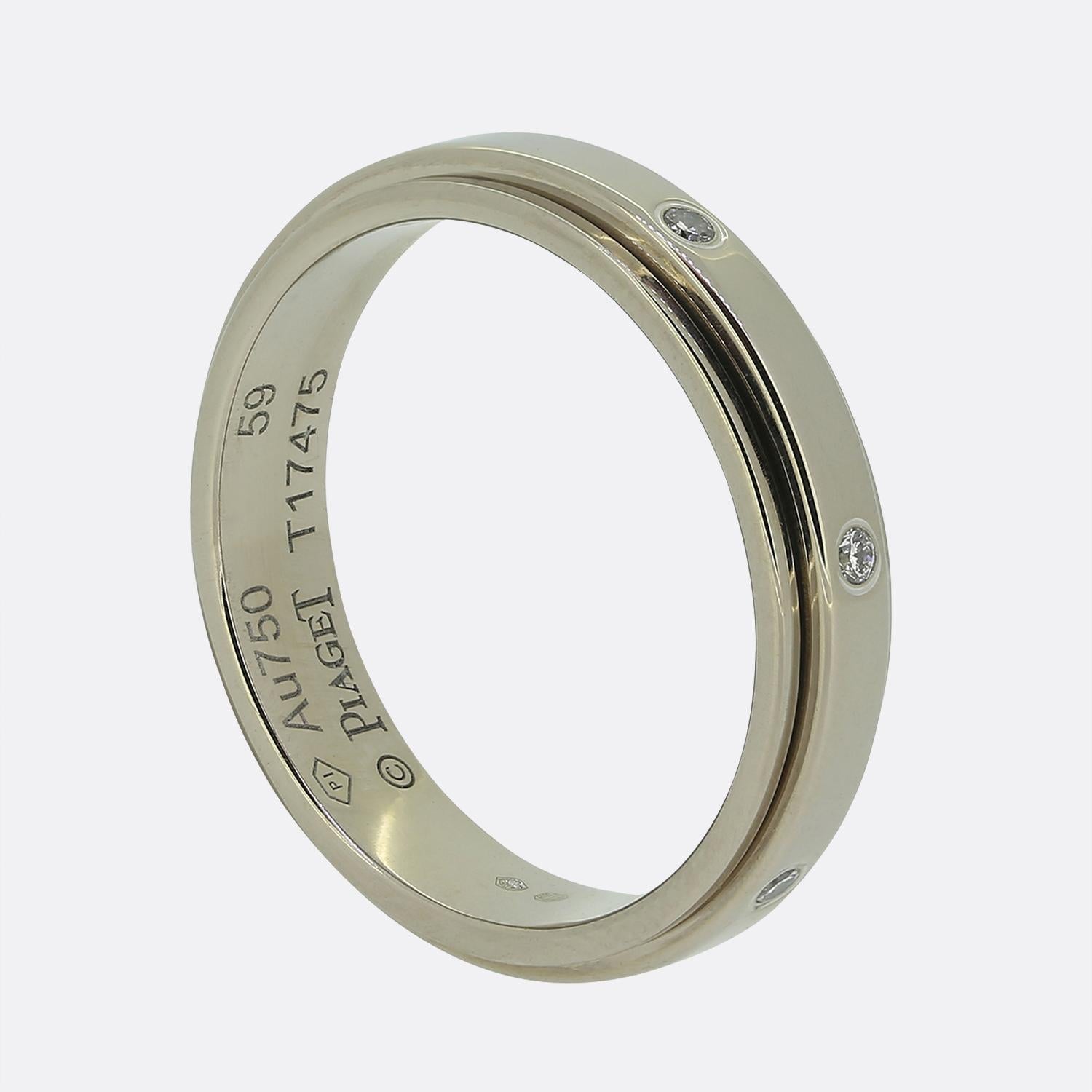 Here we have a lovely band ring from the renowned Swiss jewellery designer, Piaget. Crafted from 18ct white gold, the design showcases a sleek band adorned with evenly spaced round brilliant-cut white diamonds, each set flush into the metal for a