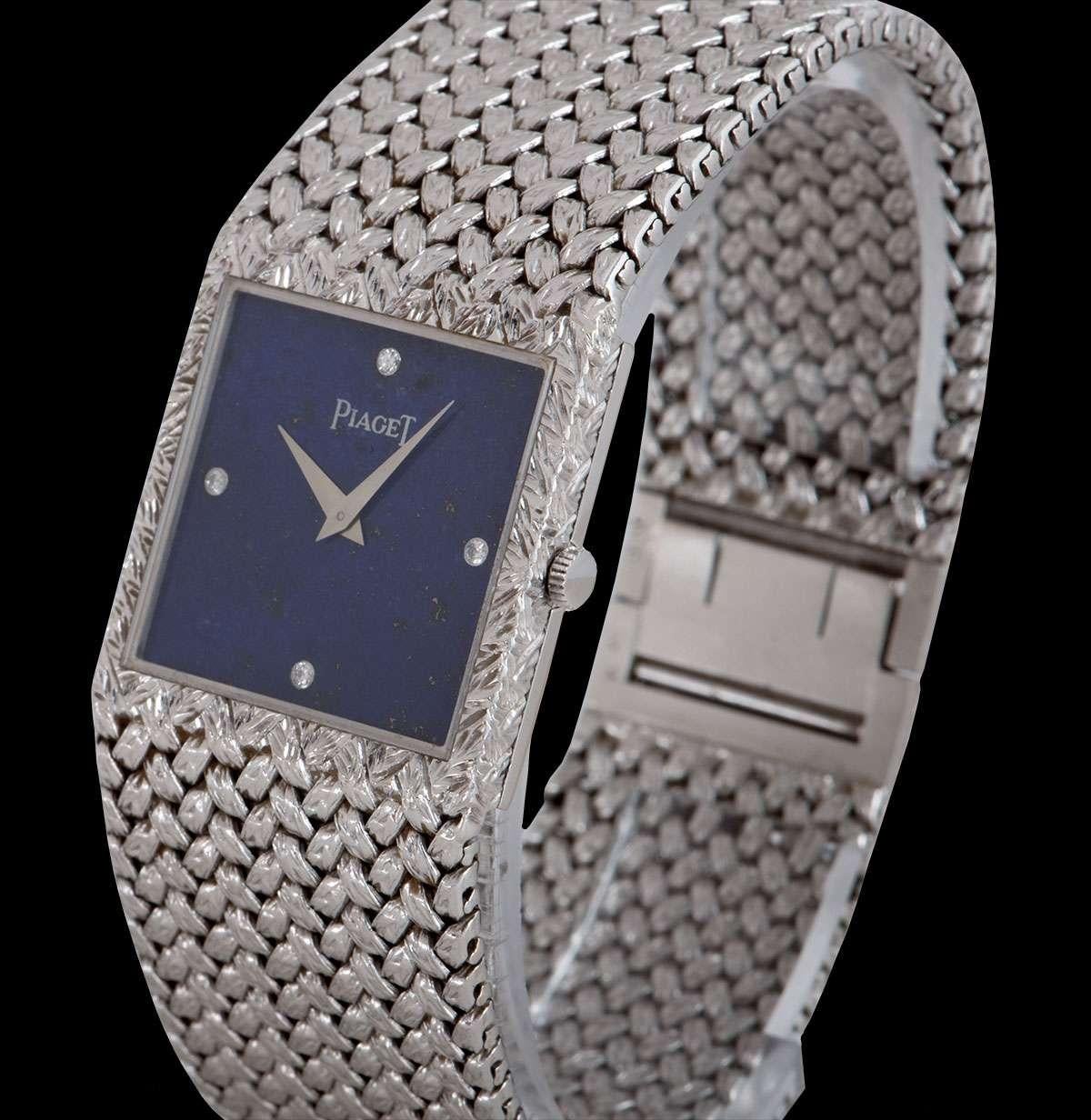 A 25 mm  18k White Gold Gents Dress Wristwatch, lapis lazuli dial set with 4 round brilliant cut diamond hour markers, a fixed 18k white gold bezel, an 18k white gold integrated bracelet with an 18k white gold jewellery style clasp, mineral glass,