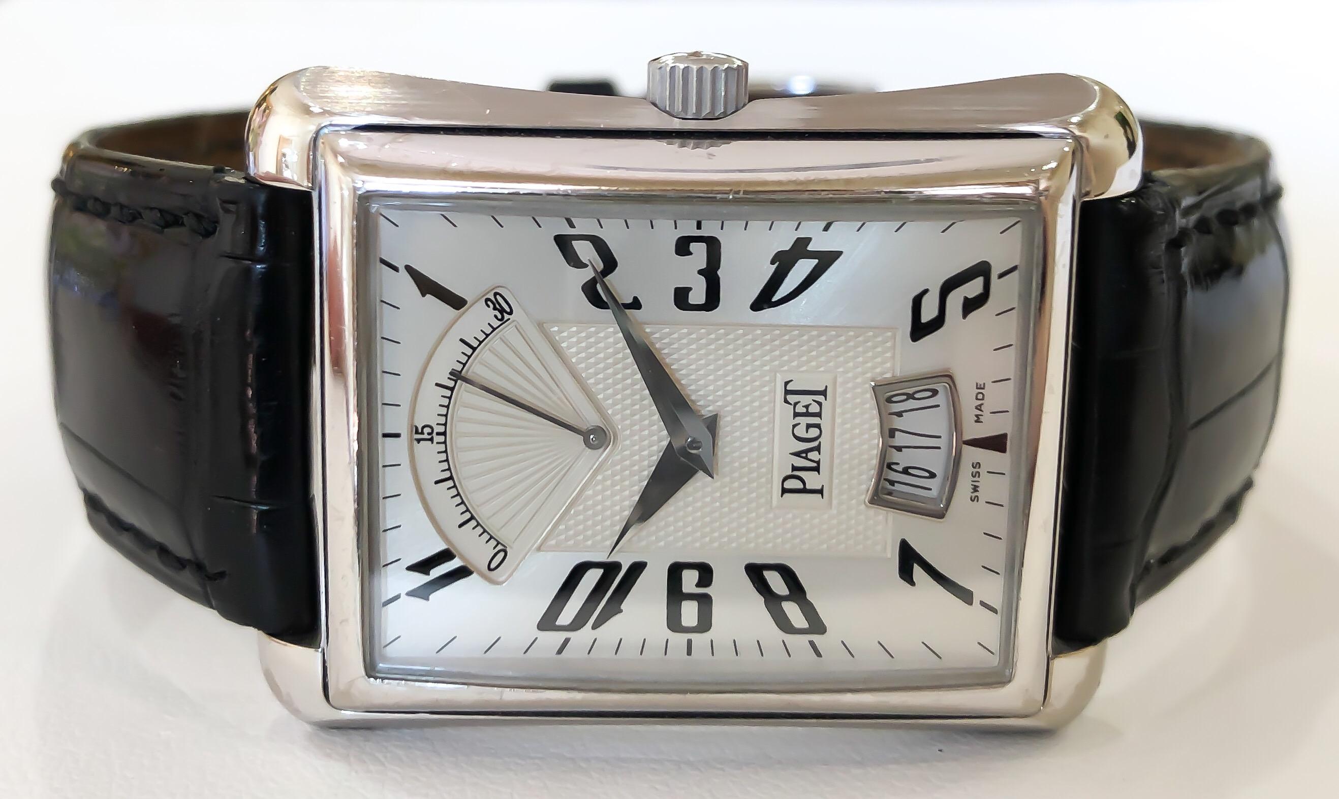 Piaget Emperador Retrograde 18K White Gold Watch w/ Second Hand & Date Window

•SERIAL NO: P1010*******
•MOVEMENT: AUTOMATIC SELF WINDING
•CASE MATERIAL: 18K WHITE GOLD
•CONDITION: LIKE NEW EXCELLENT PRE-OWNED
•CASE MEASUREMENTS: 31MM X 40MM X