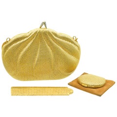 Antique Piaget Gold and Diamond Evening Purse, a Comb and a Powder Compact