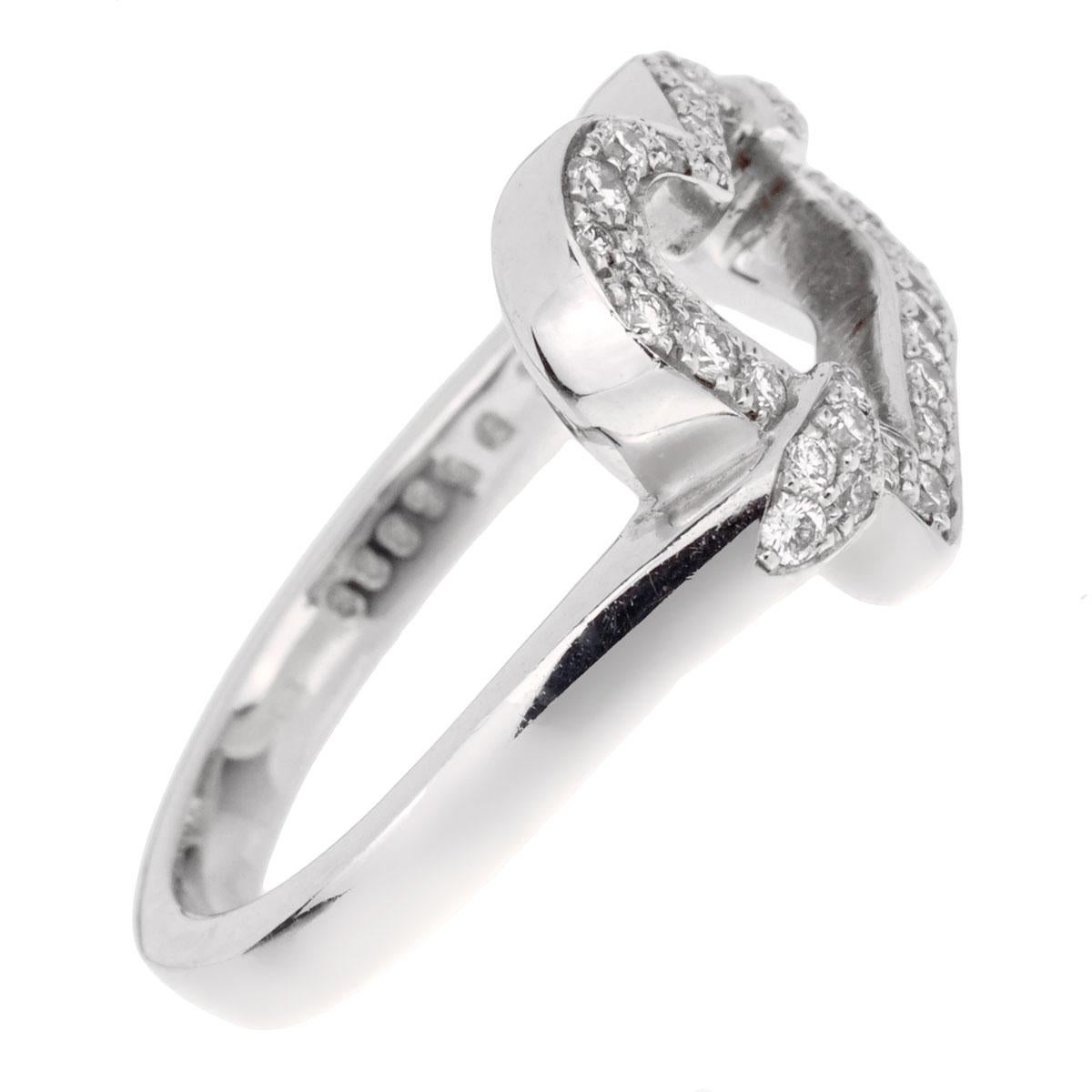 A stunning Piaget diamond ring showcasing a heart shaped motif adorned with round brilliant cut diamonds in 18k white gold. The ring measures a size 6 1/2 and is resizeable.

Sku: 1914