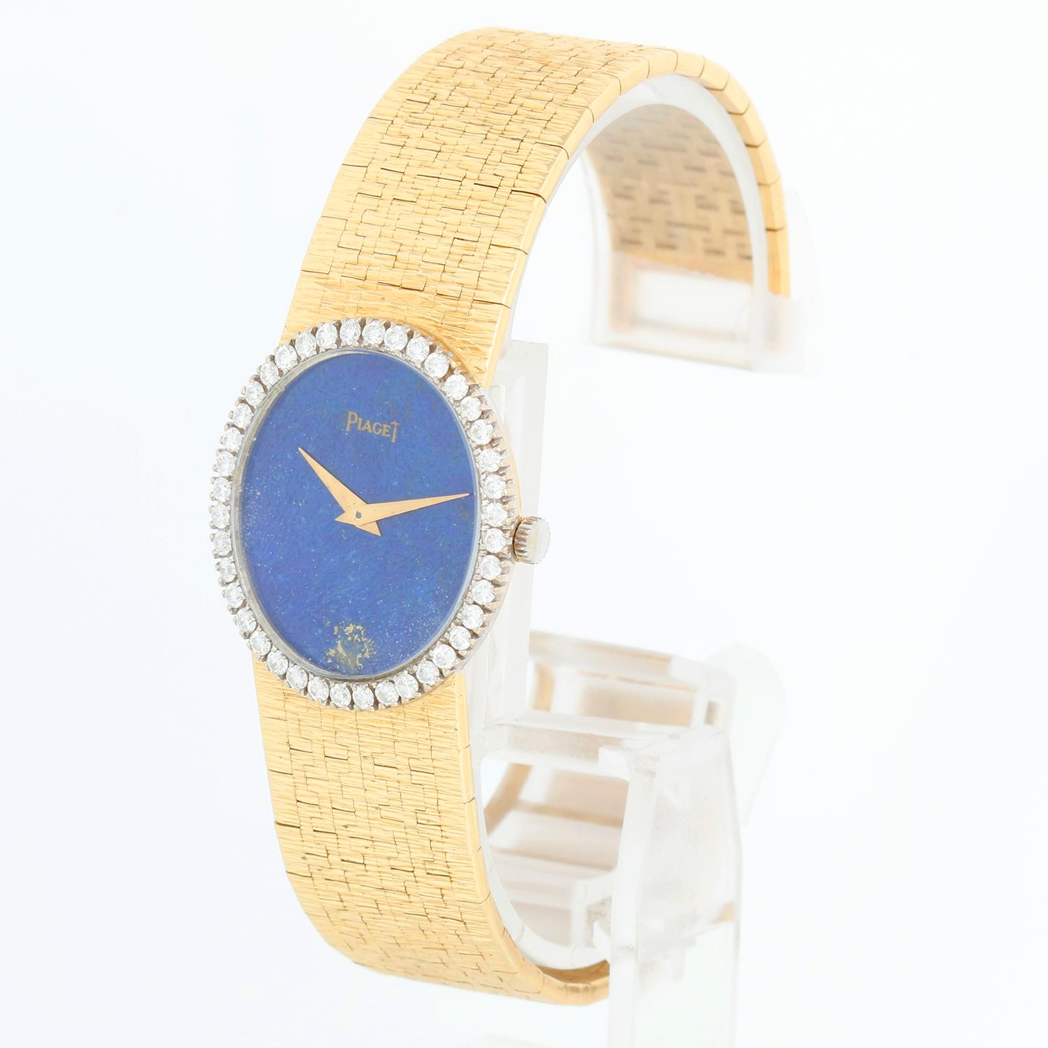 Piaget Ladies 18k Yellow Gold Dress Watch Lapis Dial  - Manual winding . 18k Yellow Gold with factory diamond bezel  (24 x 27 mm ) . Lapis Blue Dial. 18k Yellow Gold mesh bracelet; will fit up to a 5 3/4 inch wrist . Pre-owned custom box.