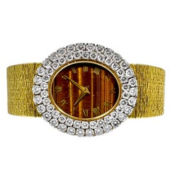 Orologio da donna Piaget 1970 in oro con lunetta a 2 file di diamanti e quadrante ovale a occhio di tigre