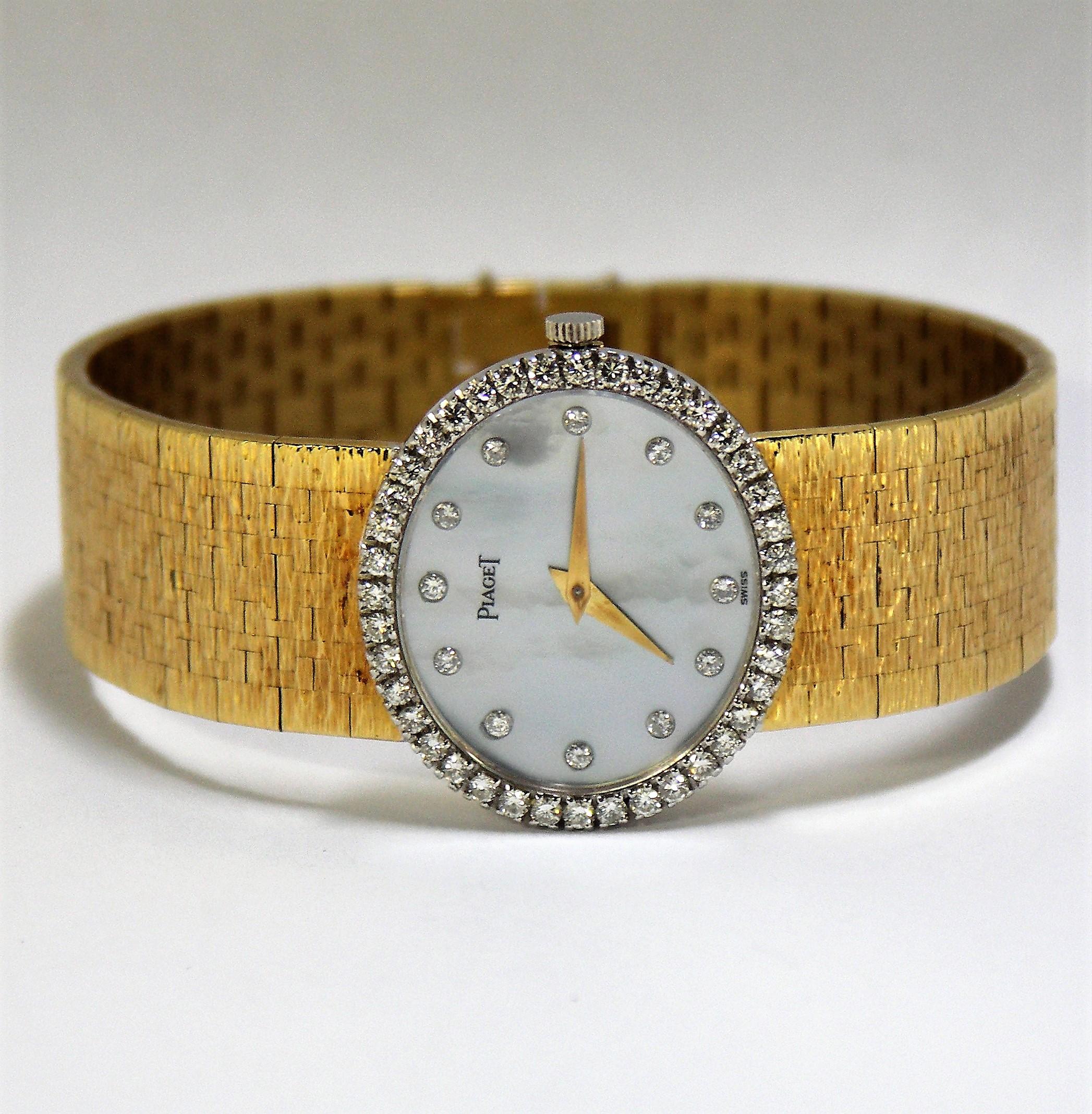 gold watch with mother of pearl face