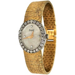 Piaget Ladies Petite Gold Watch with Mother of Pearl Diamond Dial/ Diamond Bezel