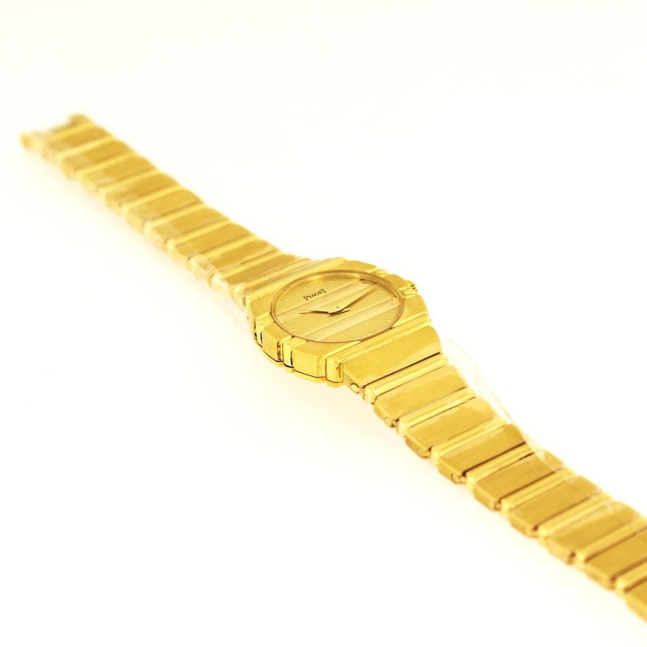 PIAGET LADIES POLO 18K YELLOW GOLD WATCH 861C701

- Condition: Mint
- Brand: Piaget
- Movement: Swiss Quartz
- Case Material: 18K Yellow Gold
- Weight: 85.9gr
- Display: Analog
- Dial Color: Gold
- Case Size: 24 mm
- Case Shape: Round
- Wrist Size: