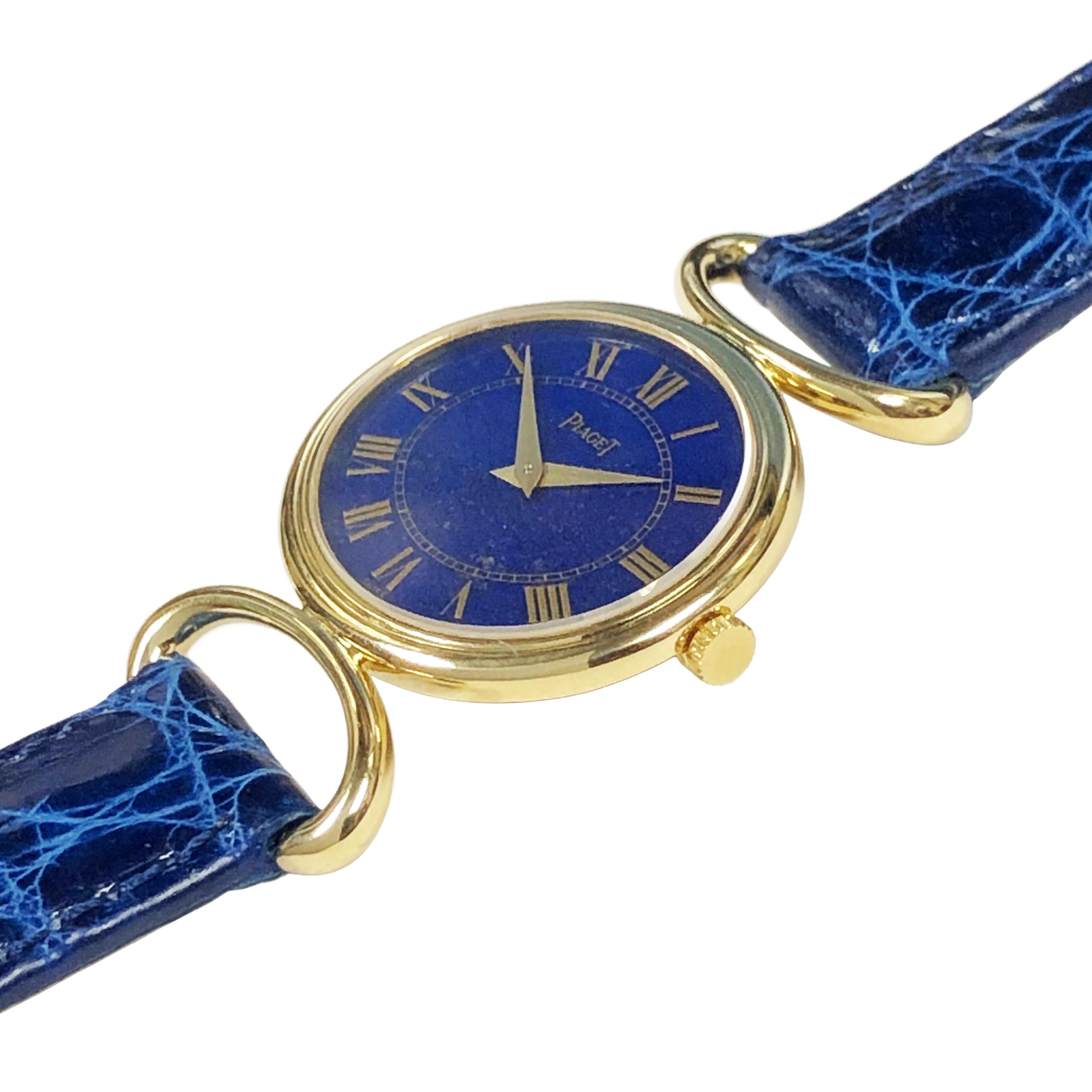 Circa 1980s Piaget Ladies Wrist Watch, 27 X 24 M.M. 18K Yellow Gold 2 Piece case with C curved Lugs, measurement of case with lugs 1 1/2 inches. 17 jewel Mechanical Manual wind Movement. Lapis Lazuli Stone Dial with Gold Printed Roman Numerals. New