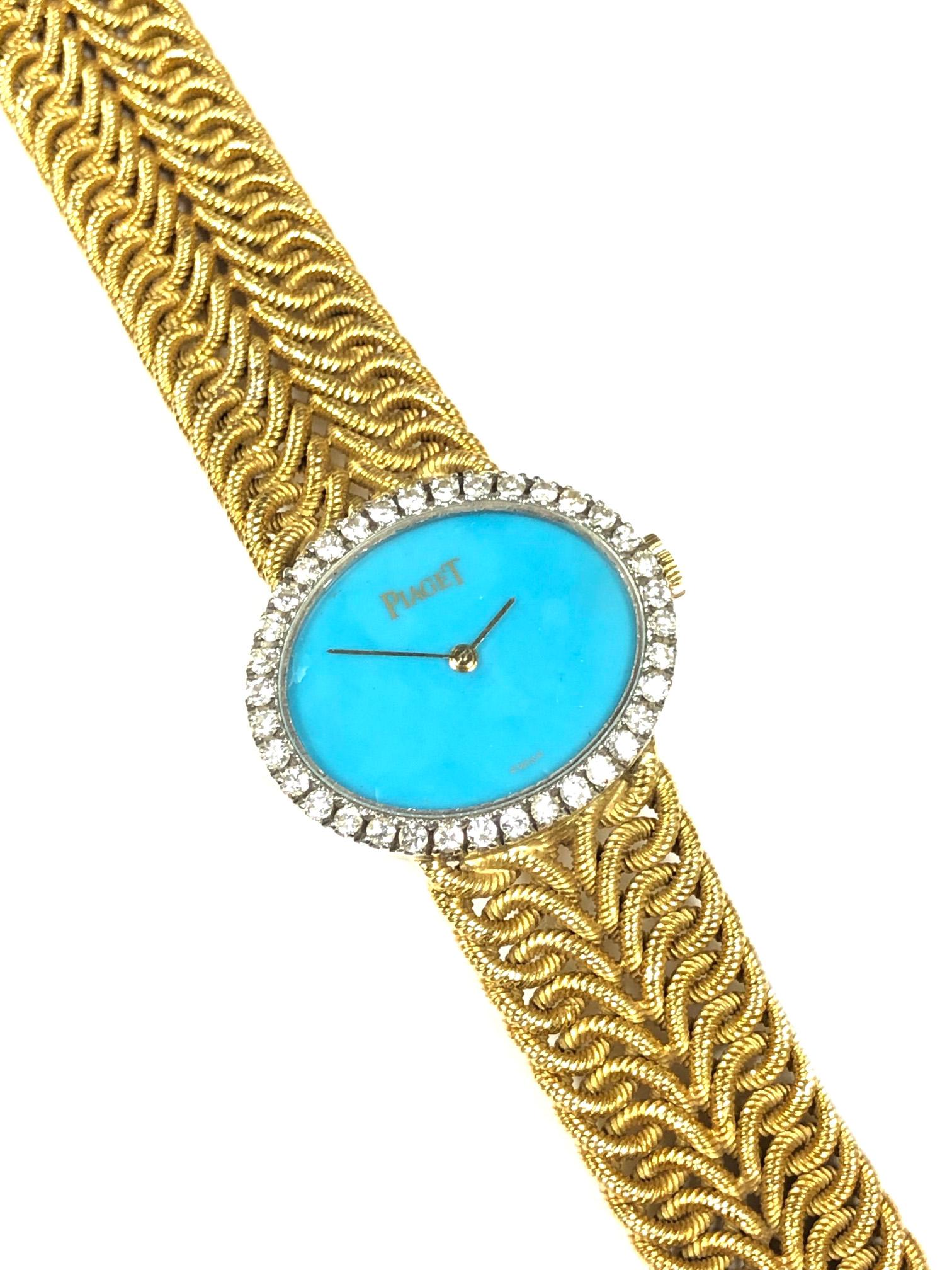 Circa 1980 Piaget Ladies Wrist Watch, 25 X 21 MM 18K yellow gold 2 Piece case with a Piaget Factory set Diamond Bezel of Round Brilliant cuts totaling approximately 1 Carat.  17 Jewel mechanical, Manual Wind Movement, Turquoise Dial. 5/8 inch wide