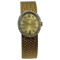 Piaget Ladies Yellow Gold Diamond Champagne Dial Wristwatch 