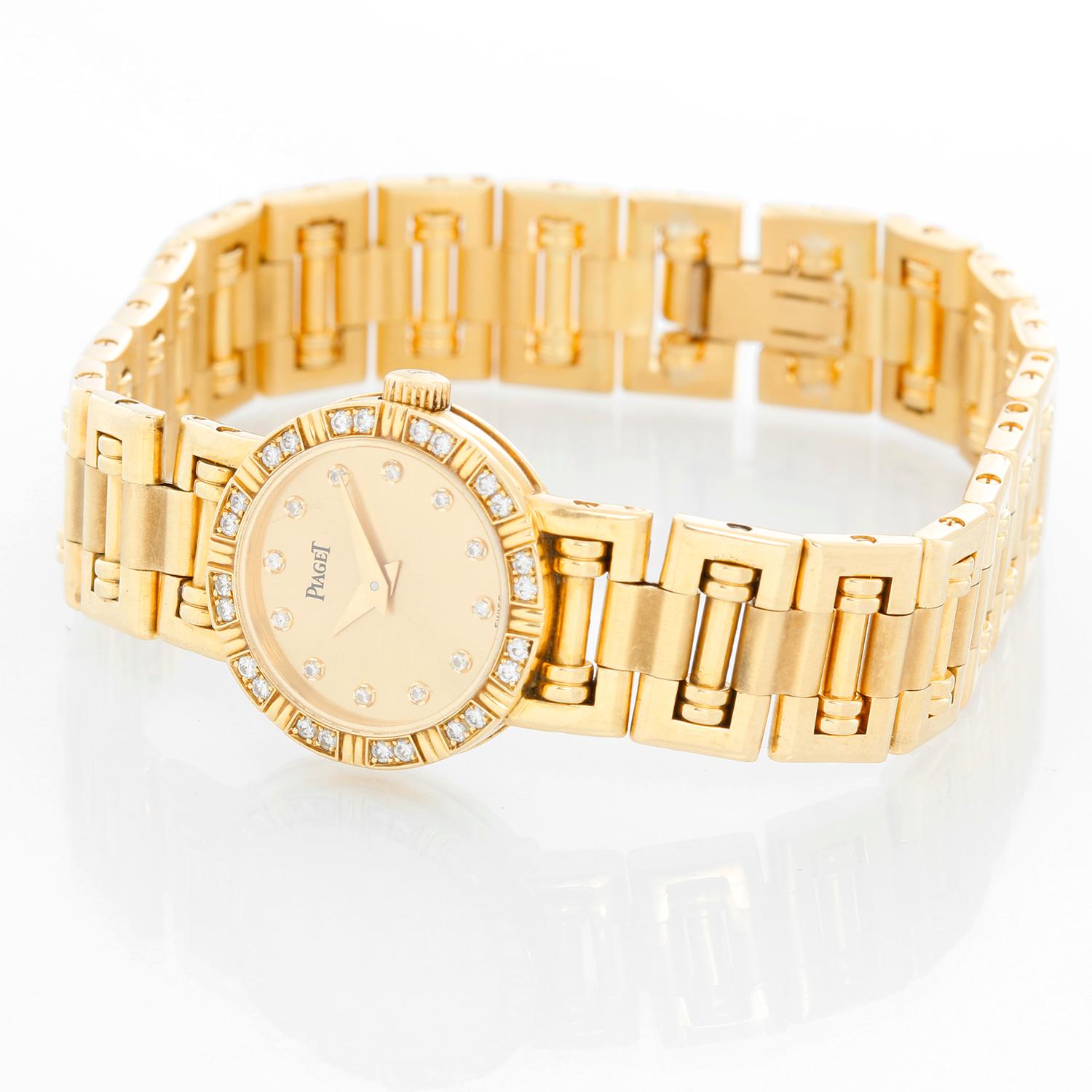 Piaget Ladies Yellow Gold Diamond Watch - Quartz. 18k yellow gold bezel with diamonds (19 mm). Champagne diamond dial. 18k yellow gold bracelet; will fit a 6 1/2 inch wrist. Pre-owned with custom box. 