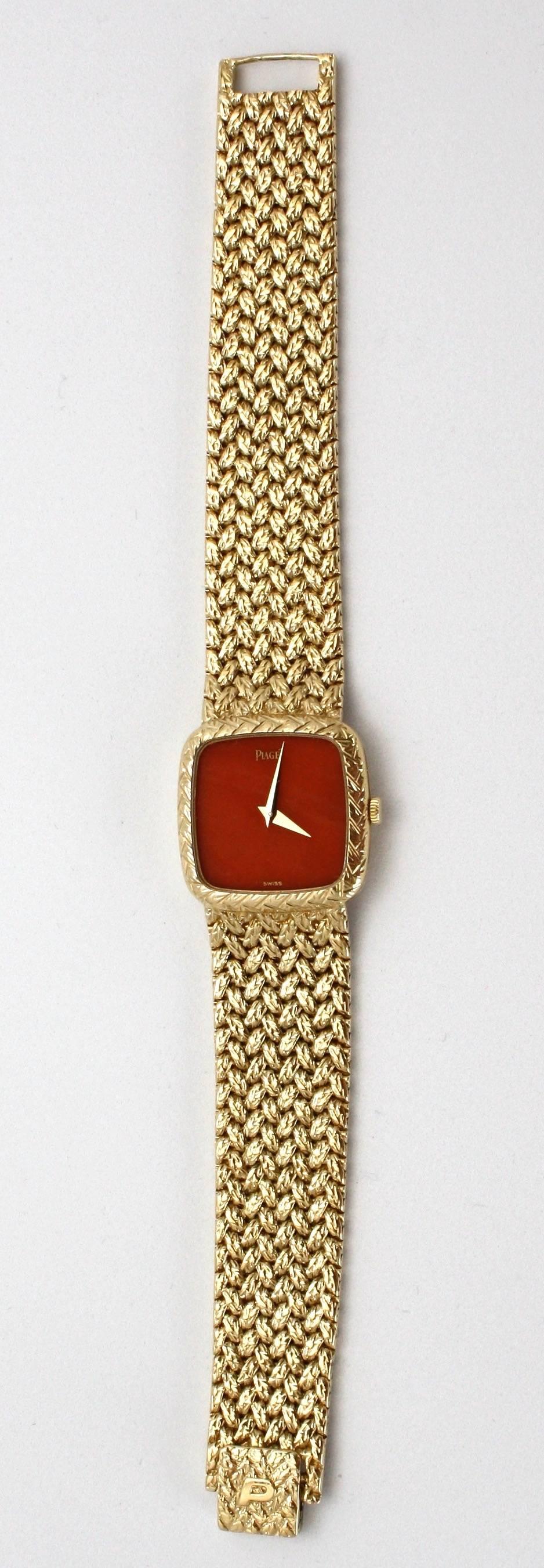 This amazing watch is for collectors.  It is a Piaget with a Coral Face and woven bracelet band. This is very rare and highly collectible.  Coral has been endangered for a long time now (over 20 years),  so Coral is no longer used for watch faces. 