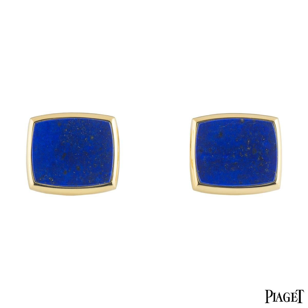 A stylish pair of 18k yellow gold lapis lazuli cufflinks by Piaget. Each cufflink is set to the front with a lapis lazuli in a rubover setting. The cufflinks measure 1.8cm in height and 2cm in width. The cufflinks have T-bar fittings and have a