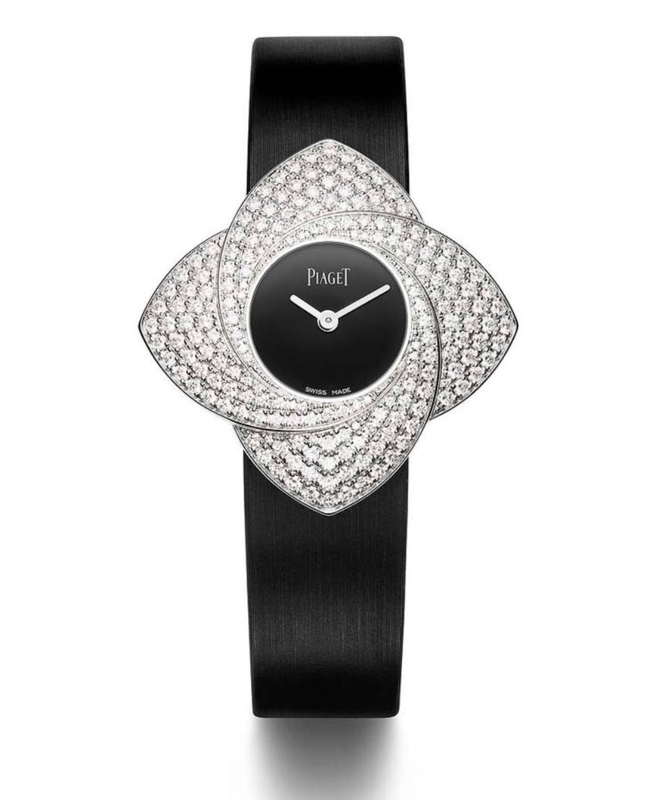 Twist the case and the petals unfurl on the Limelight Blooming Rose wristwatch by Piaget.
256 diamonds totaling approximately 2.50 carat.
Size: 34 mm. x 34 mm.
Signed Piaget and numbered.
Piaget original box.

Bracelet length: From 13.5 centimeters