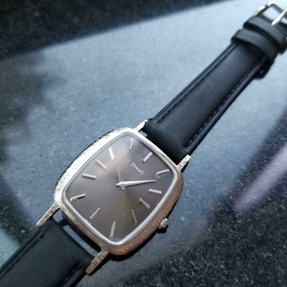 Luxurious classic, men's 18k white gold Piaget hand-wound dress watch, c.1970s. Verified authentic by a master watchmaker. Gorgeous black Piaget signed dial, applied indice hour markers, silver minute and hour hands, hands and dial in excellent