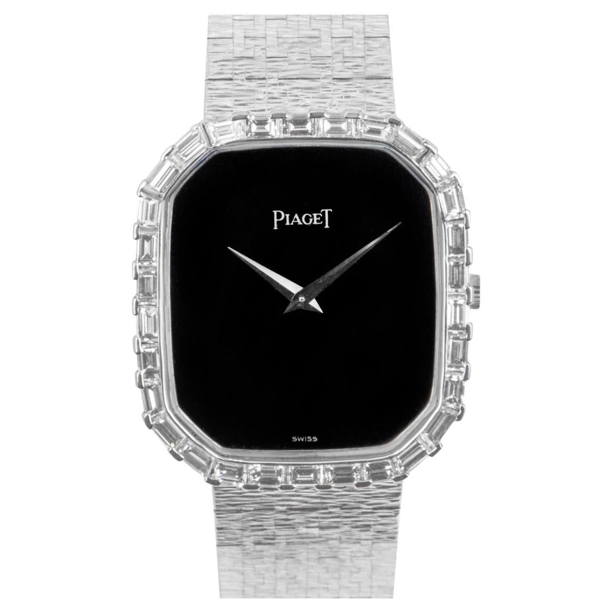 An 18k white gold Octagonal Case men's wristwatch, by Piaget.

This vintage wristwatch features a black onyx dial, which is complemented with a fixed octagonal bezel, set with 30 baguette cut diamonds.

Further features include an 18k white gold