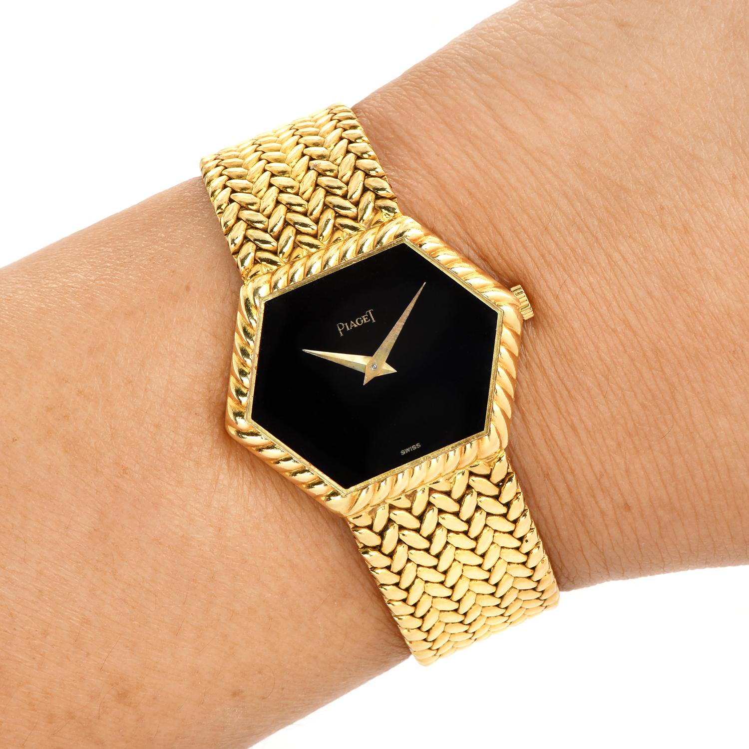 Pre-Owned Piaget reference number 9559, rare hexagonal bezel.

Elegant solid all 18K Yellow gold watch, features a 30 mm x 23 mm, 18k yellow gold Case with Fold over clasp.
This Vintage 18k Gold watch has a Black Onyx Dial with gold-tone