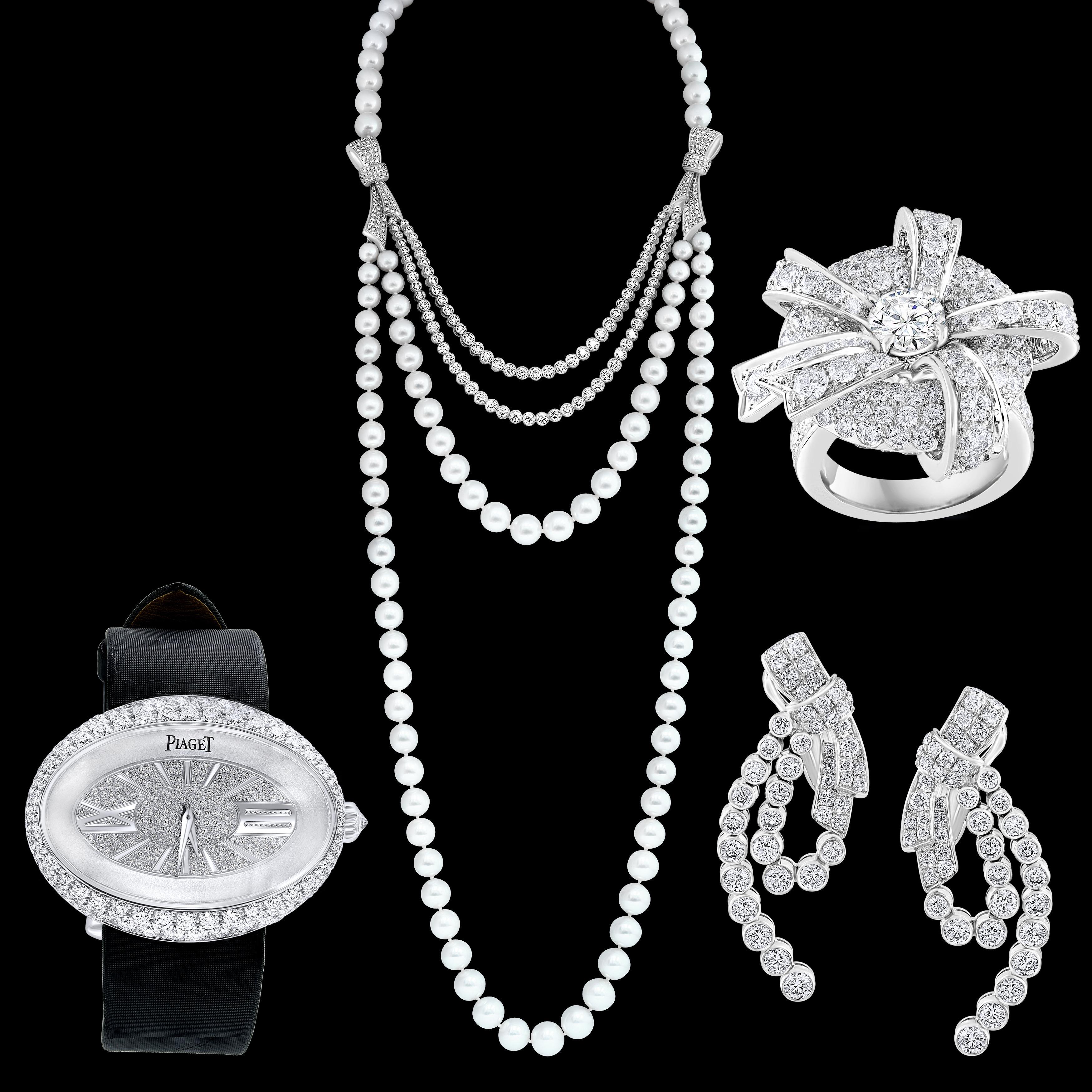 South Sea Pearl & VVS quality Diamonds 4 Piece Set  Necklace, Watch , Earring and Ring Suite 18 Karat White Gold 285 Gm  with Each piece is signed PIAGET , 750 , PT  and serial # 
Full length of the necklace is 36 inches with both pearl string