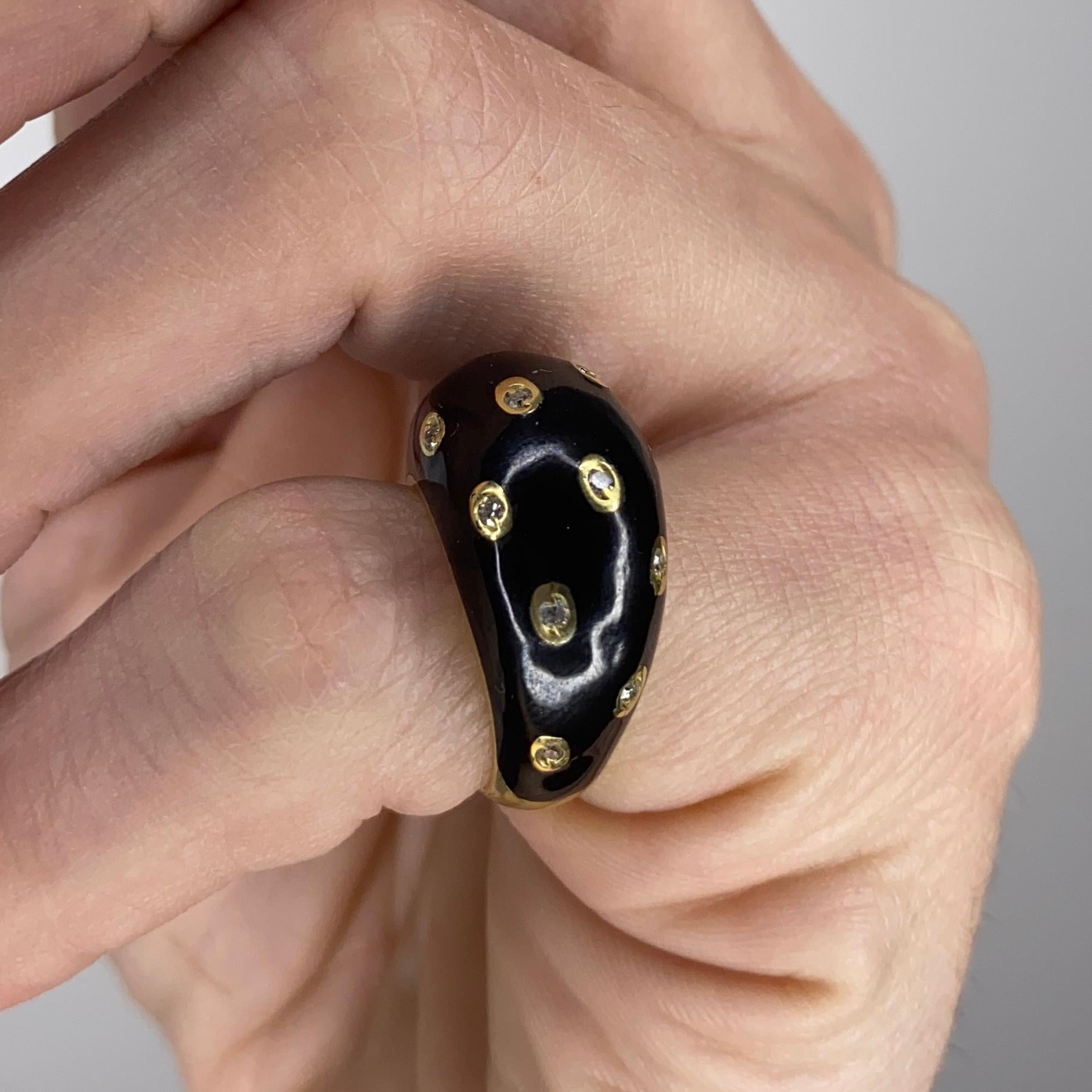 Panther pattern ring designed by Piaget.

Very nice and unusual cocktail ring crafted with a domed bombe shape in solid yellow gold of 18 karats and embellished with applications of black enamel creating a feline skin pattern.

Diamonds: French set