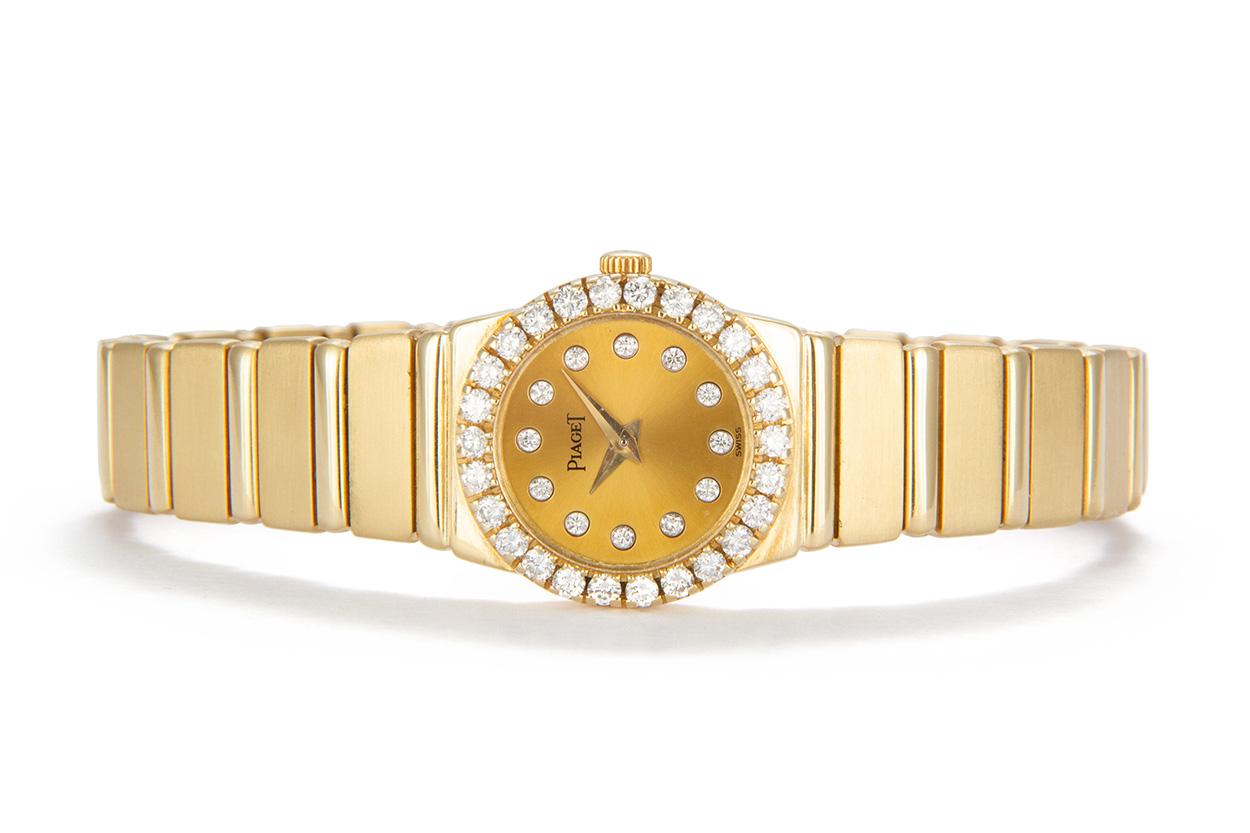 We are pleased to offer this Piaget Polo 18k Yellow Gold Diamond Ladies Watch 8296 C. This stunning watch features solid gold 21mm case set with high quality white round brilliant cut diamonds, a champagne diamond dial with sapphire crystal, solid