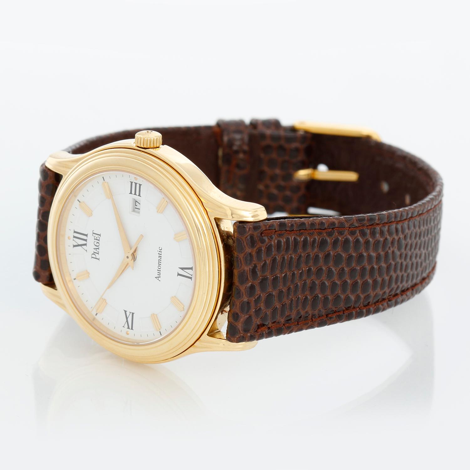 Piaget Polo 18K Yellow Gold Men's Watch GOA781 - Automatic. 18K Yellow gold ( 33  mm ). White dial with gold markers and black Roman numerals. Brown leather strap with tang buckle . Pre-owned with custom box.
