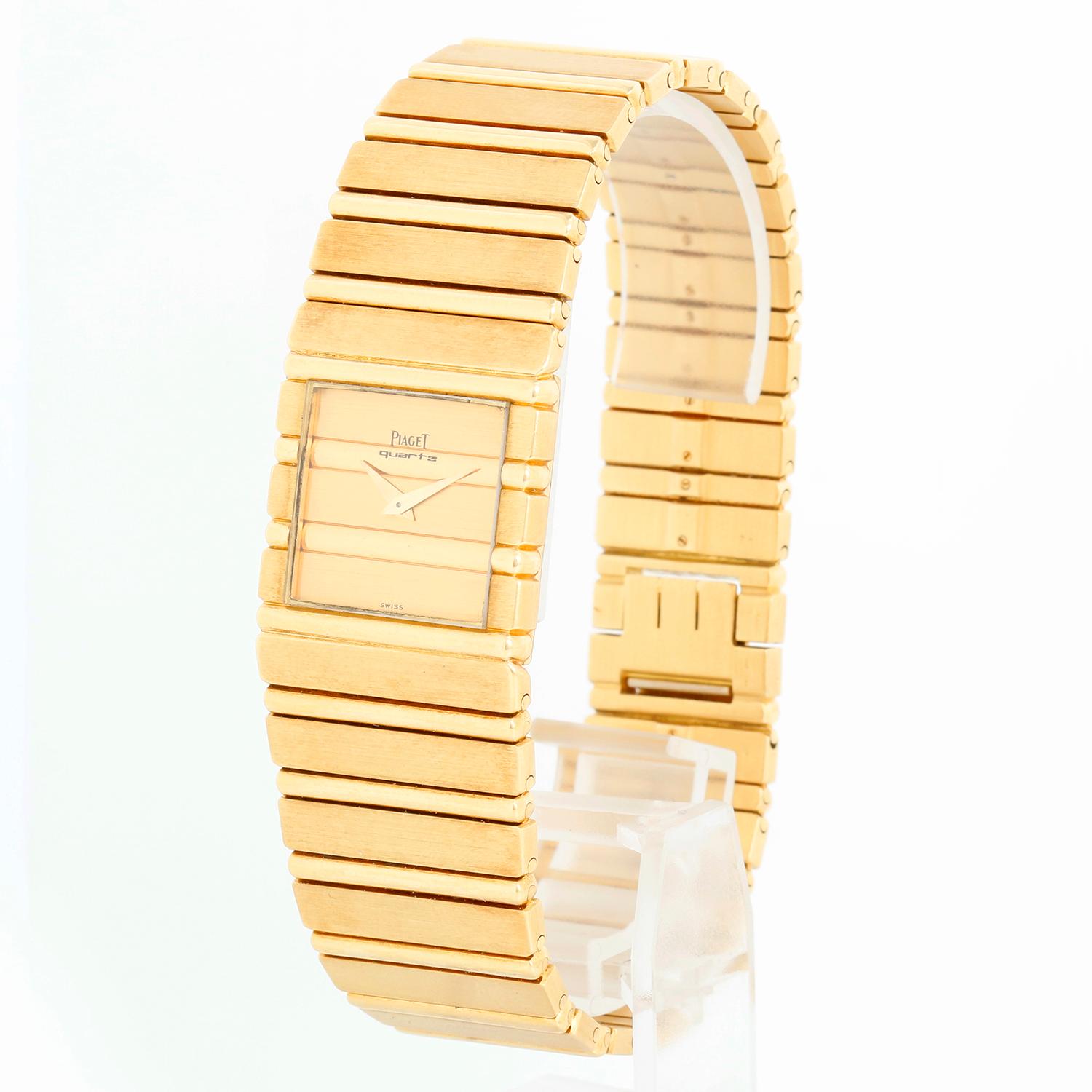 Piaget Polo 18K Yellow Gold Men's Watch 7131 C701 - Quartz. 18K Yellow Gold ( 25 x 25 mm ). Gold dial with round hour markers. 18K Yellow Gold bracelet; will fit an 8 inch wrist . Pre-owned with Piaget travel box.