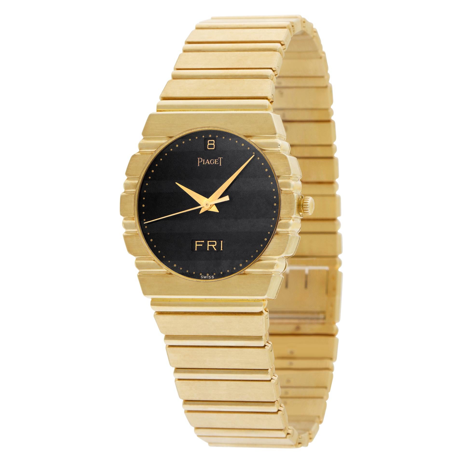 Piaget Polo Day-Date with black bar dial in 18k yellow gold. Quartz w/ sweep seconds, date and day. 31.5 mm case size. With box and papers.Ref 15562 C 701. Circa 1980s. Fine Pre-owned Piaget Watch. Certified preowned Dress Piaget Polo 15562 C 701