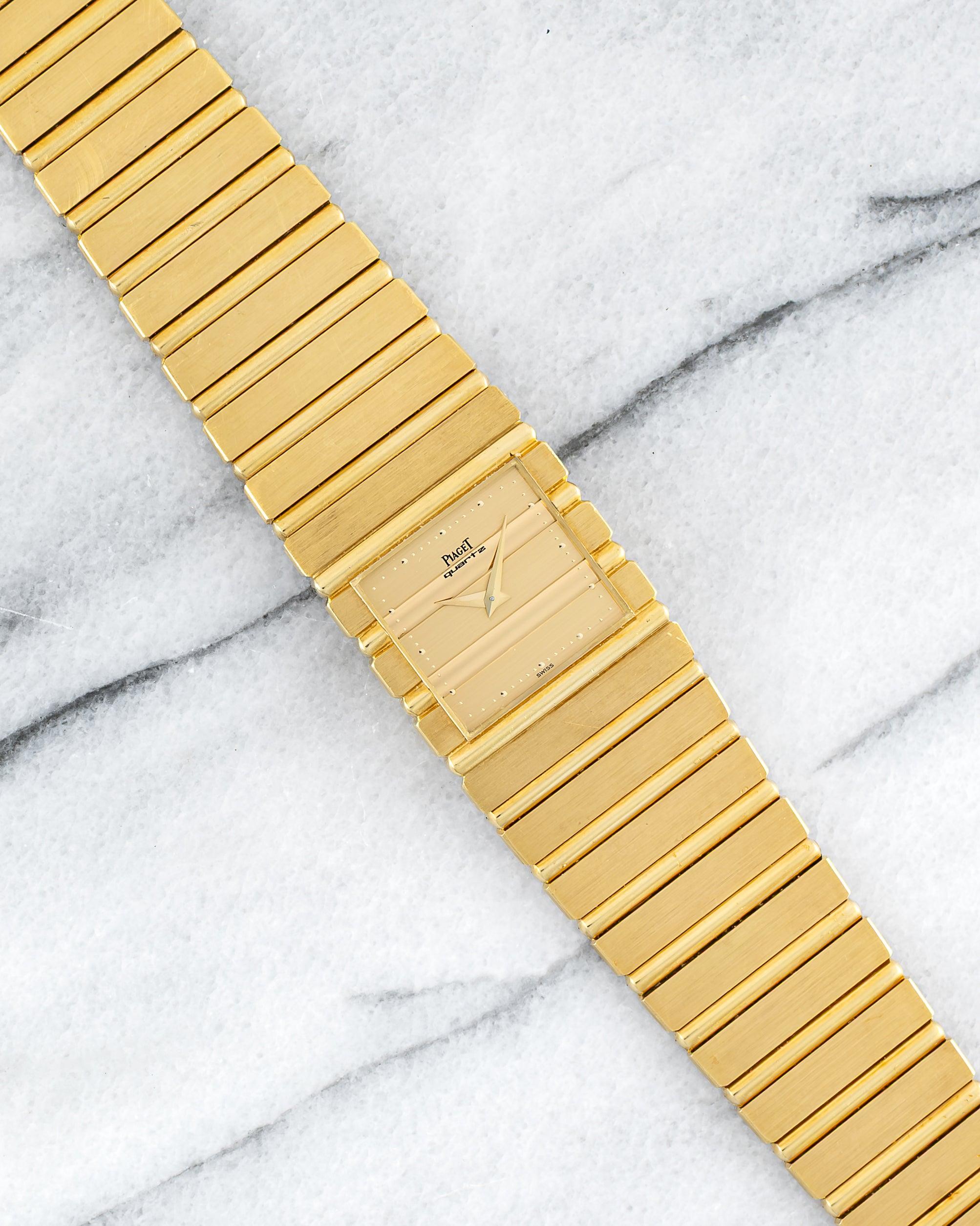 Here's a vintage Piaget Polo Cuff reference 7131 Quartz in 18K yellow gold from the 1980s. Keeps great time and is fully functional. Recently serviced. Truly unpolished example. The bracelet fits up to a 6.75 inch wrist. (The links have screws so
