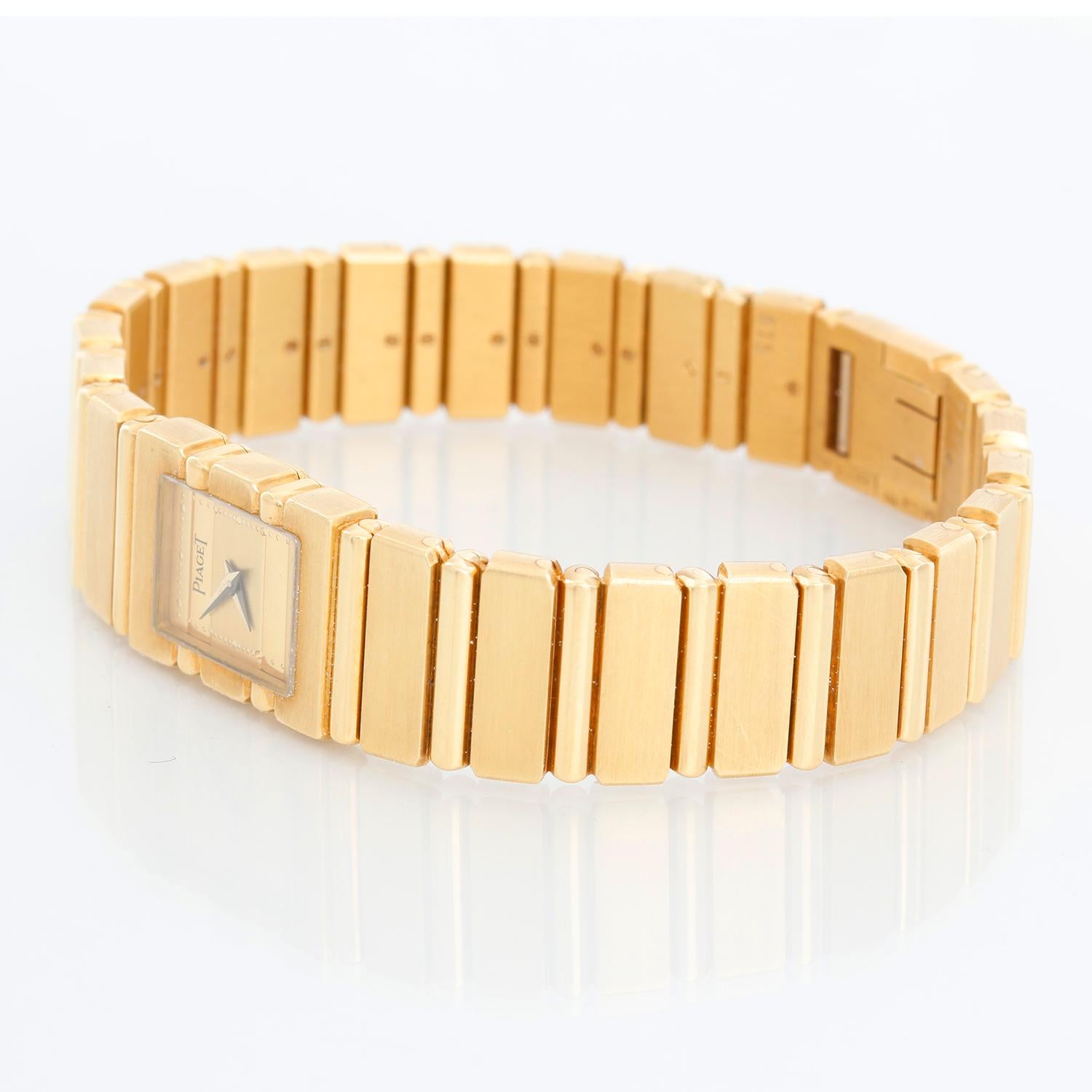Piaget Polo Mini  18K Yellow Gold Watch - Quartz. 18K Yellow gold ( 14 x 20 mm ). Champagne dial. 18K Yellow Gold Piaget Bracelet with 18K Yellow gold deployant clasp; will fit a 6 1/2 inch wrist. Pre-owned with Piaget  box and papers.