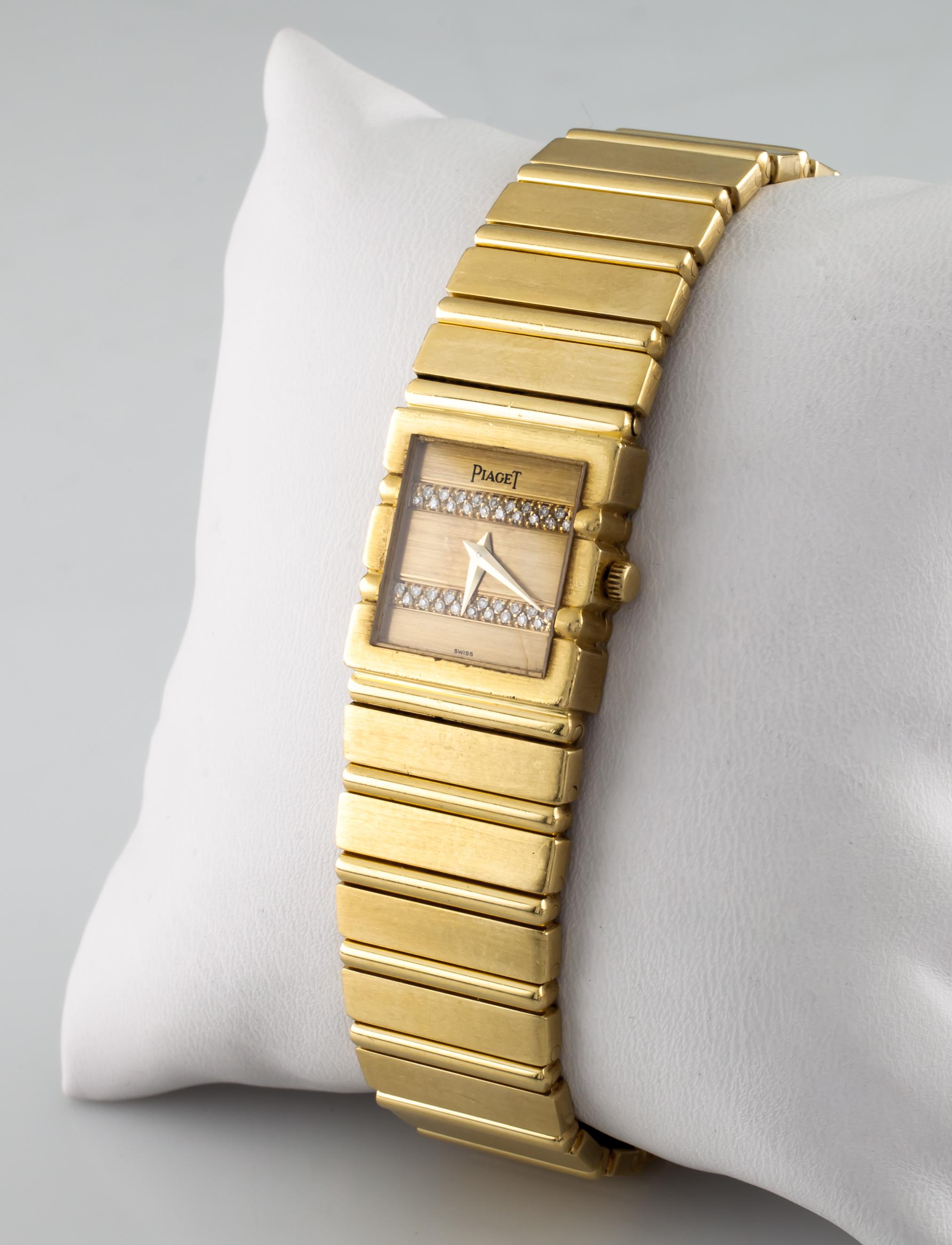 Case #8131C.701-458116
18k Yellow Gold Case
19 mm Wide 
20 mm Long
Lug-to-Lug Distance = 20 mm
Thickness = 5 mm
Gold Dial with Two Strips of Pavé Set Diamonds
Labeled 