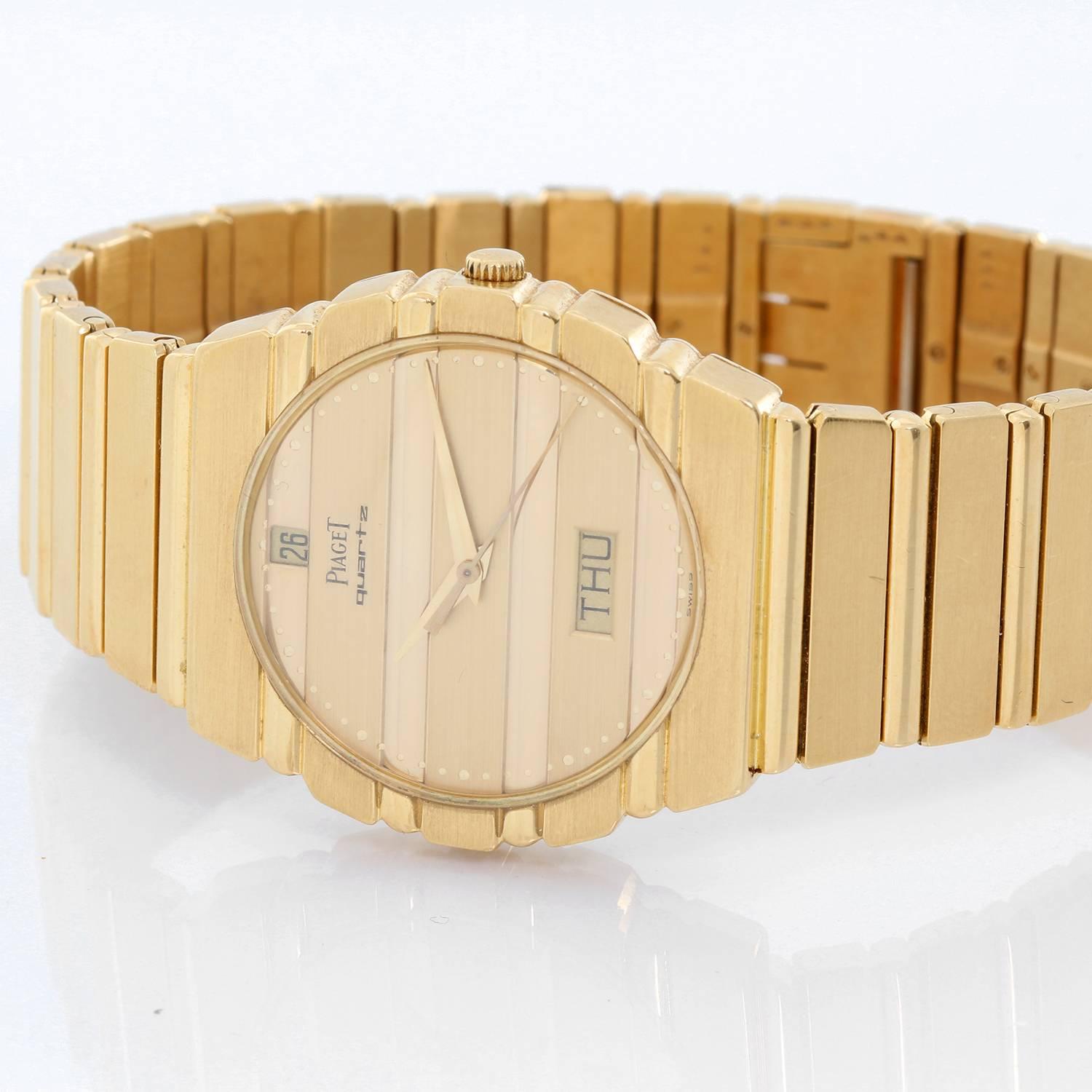 Piaget Polo Yellow Gold Watch with Day & Date 15562 C701 -  Quartz. 18K Yellow gold ( 31 mm ). Gold dial with day and date. 18K Yellow Gold Bracelet. Pre-owned with box. Inscription on back JLW & CO. 1957-1982.
