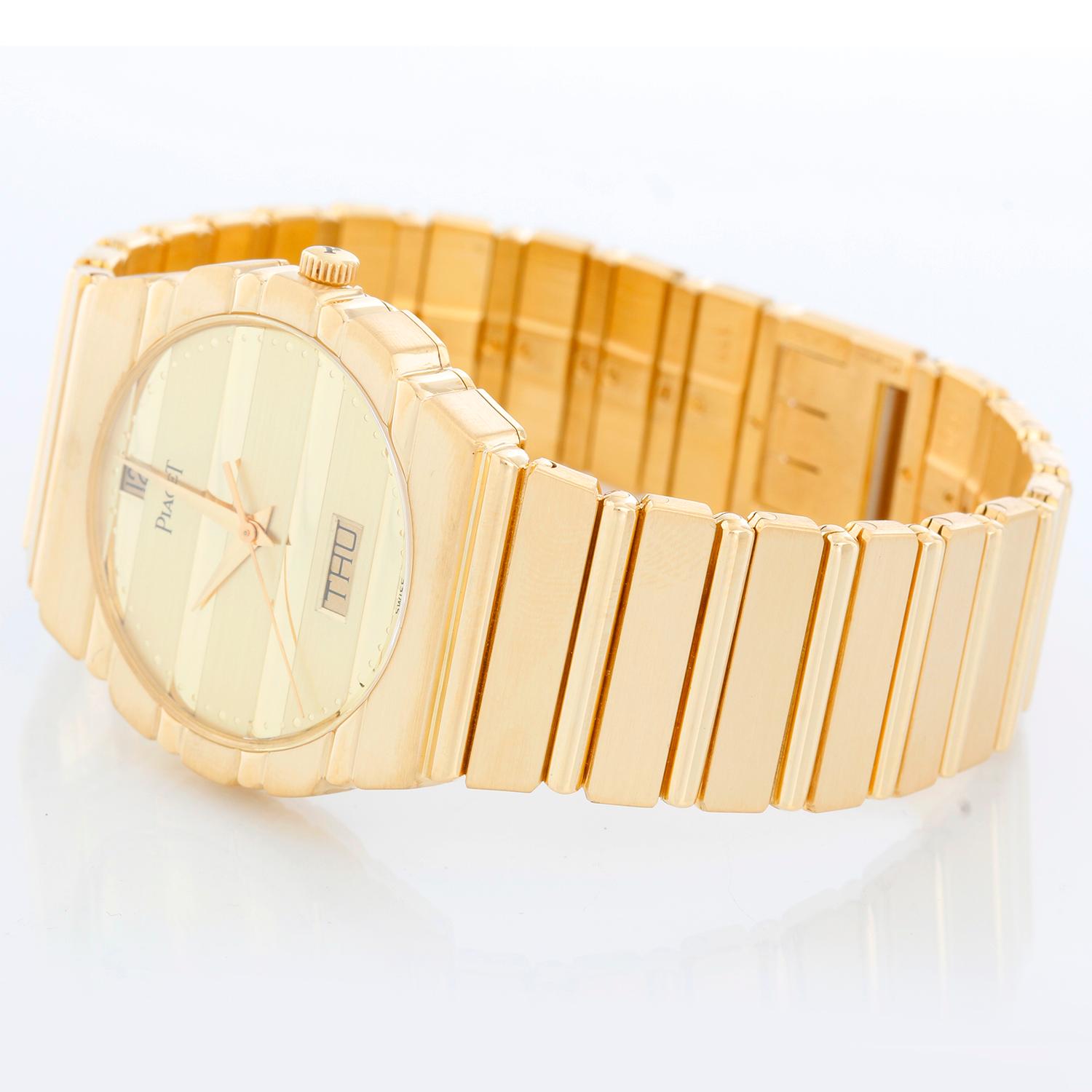 Piaget Polo Yellow Gold Watch with Day & Date Men's Watch  15562 C701 - Quartz. 18K Yellow gold ( 31 mm ). Gold dial with day and date. 18K Yellow Gold Bracelet; will fit up to a 7 inch wrist . Pre-owned with Piaget box.