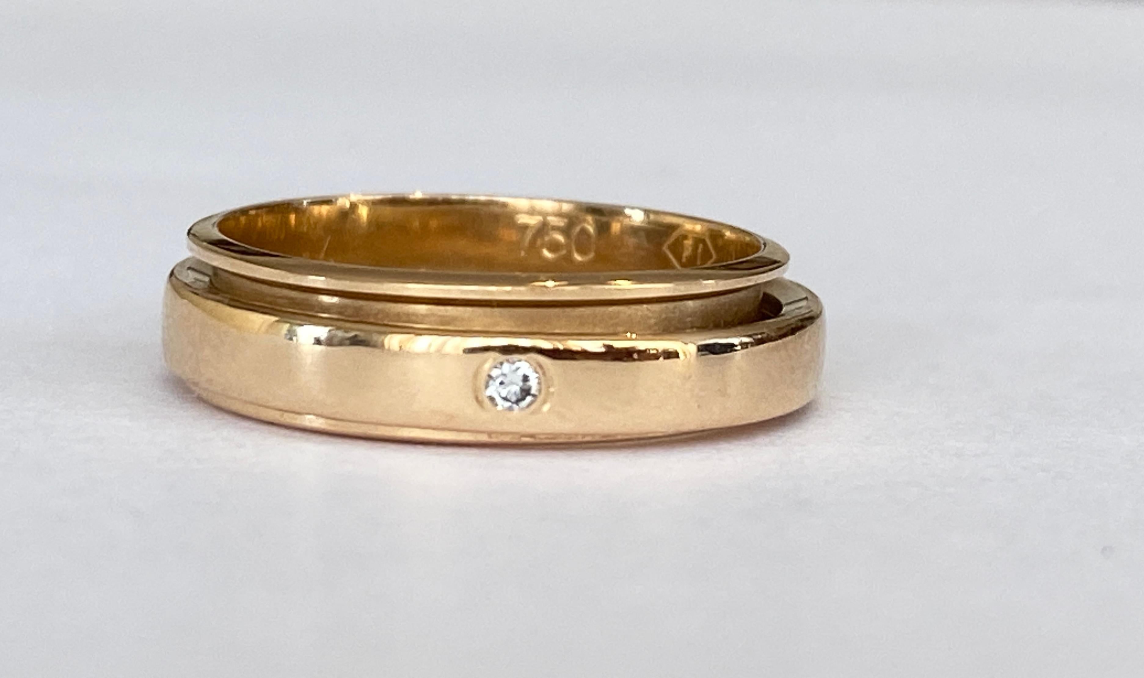 Offered in good condition is a rotating ladies Piaget ring, set with one diamond. Open ring Possession in yellow gold 18 kt, set with a brilliant cut diamond of approx. 0.02 ct of quality G/VS. Marked Piaget 750 numbered E40376, size 48/15.25 mm.