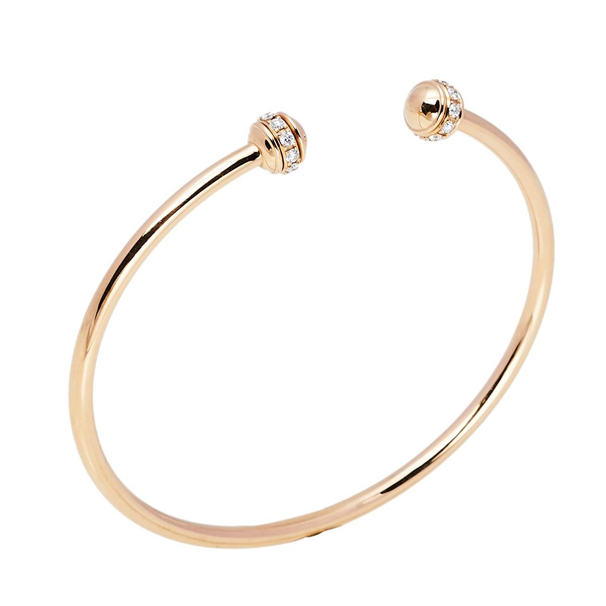 Show your love for fine artistry and luxury accessories with this stunning open cuff bracelet from Piaget that is made from 18k rose gold. One of the most popular collections from Piaget is Possession which is defined by rotating rings. The beauty