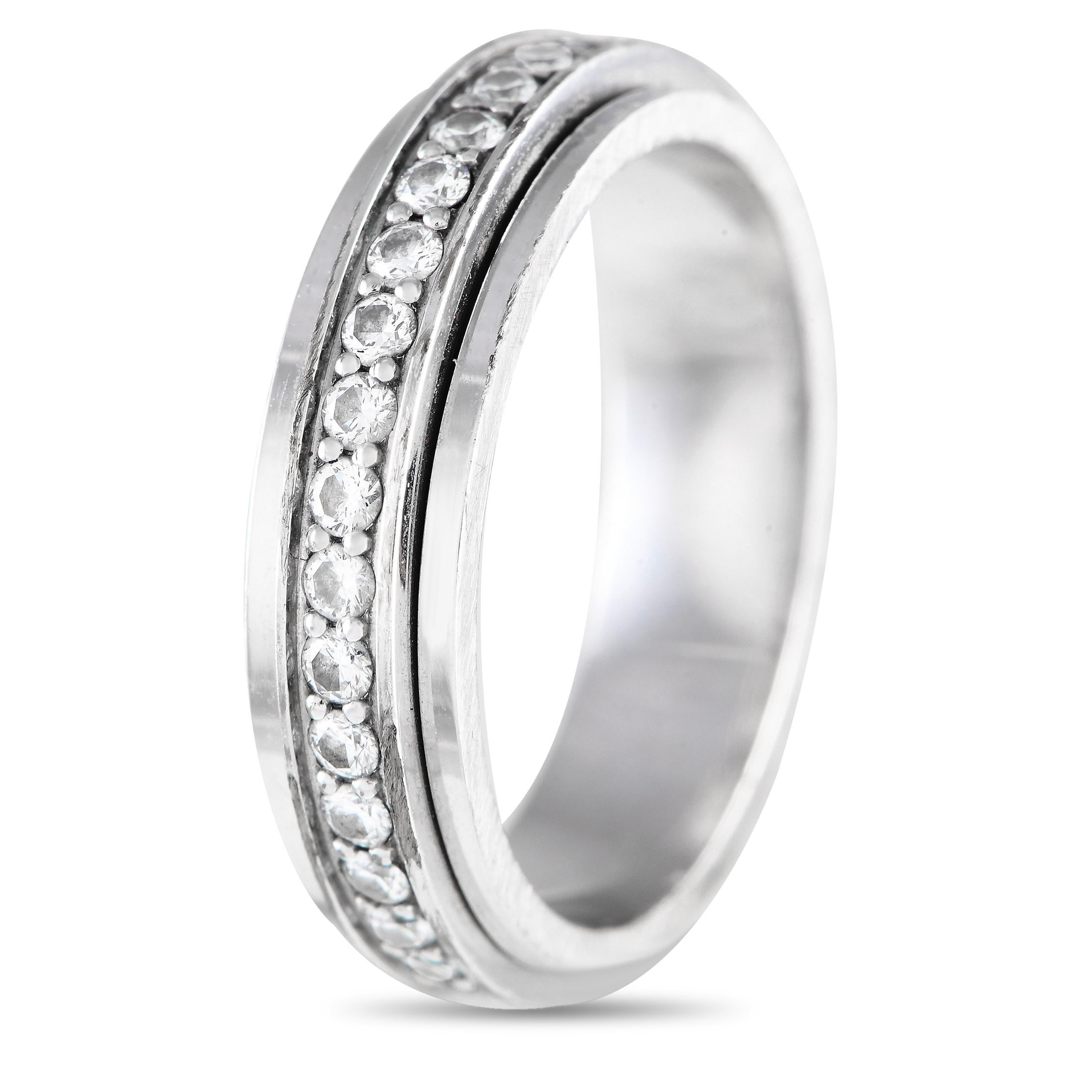 A captivating ring of extraordinary style, here is Piaget's Possession ring in white gold glittering with 0.24 carats of brilliant diamonds. This stylish ring features a central turning band that shimmers as it moves around the finger. The ring's