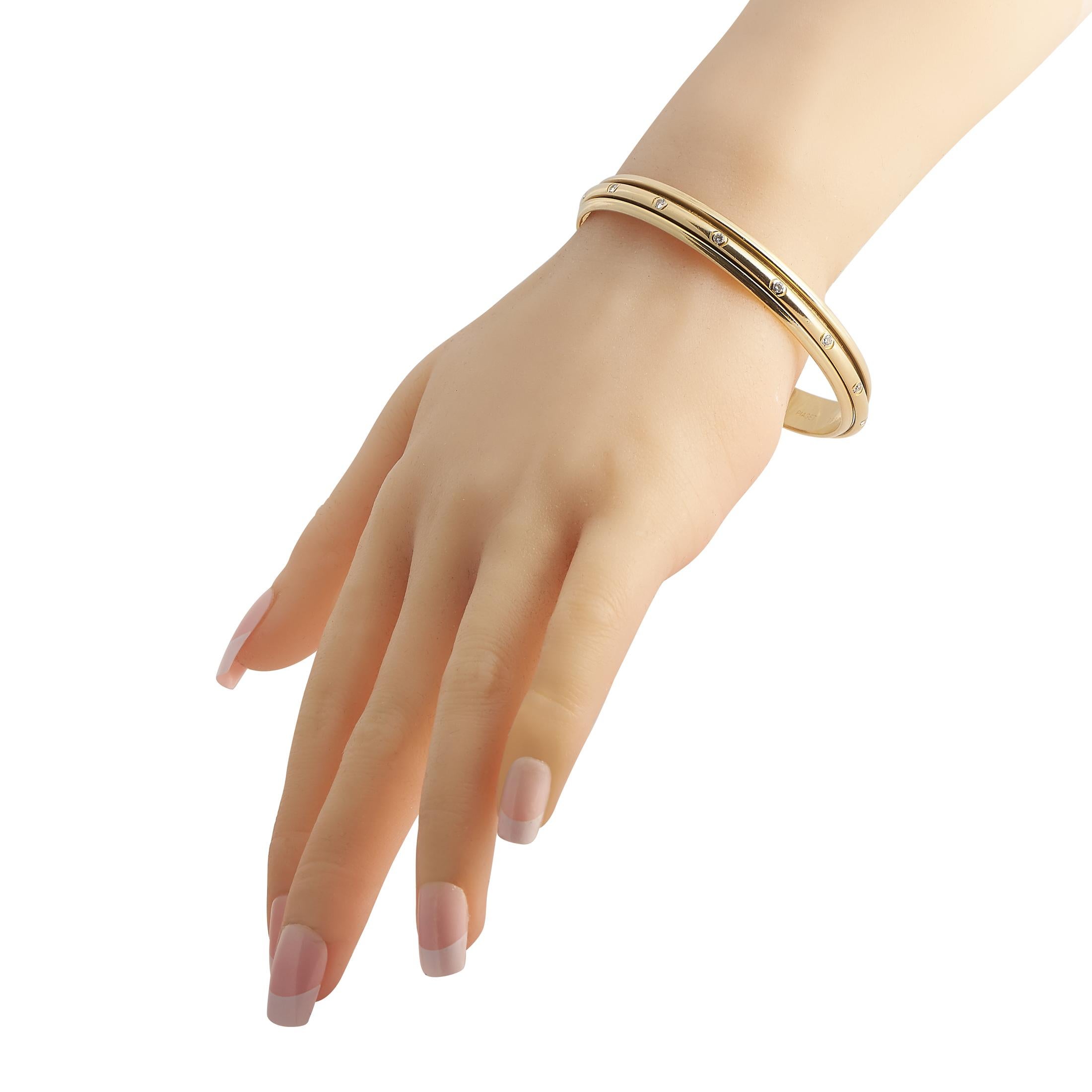 This Piaget Possession bangle bracelet is a delicate piece with a minimalist point of view. Lustrous 18K Yellow Gold provides an elegant foundation for this understated accessory, which measures 7.5” long and is adorned by a series of sparkling