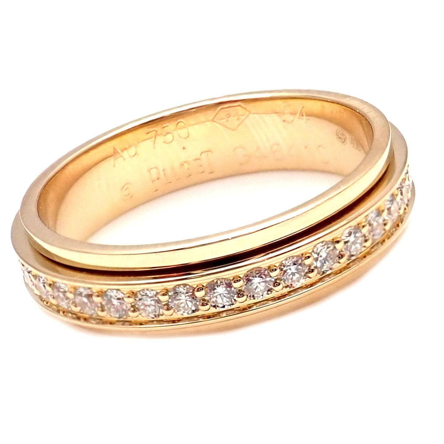 18k Yellow Gold Possession Diamond Rotating Band Ring by Piaget. 
With 45 brilliant round cut diamonds approximately .90ct
Details: 
Size: US 6.75 EU 54
Weight: 4.8 grams
Width: 4.5mm
Stamped Hallmarks: AU 750, G46410, 54, PIaget 
*Free Shipping