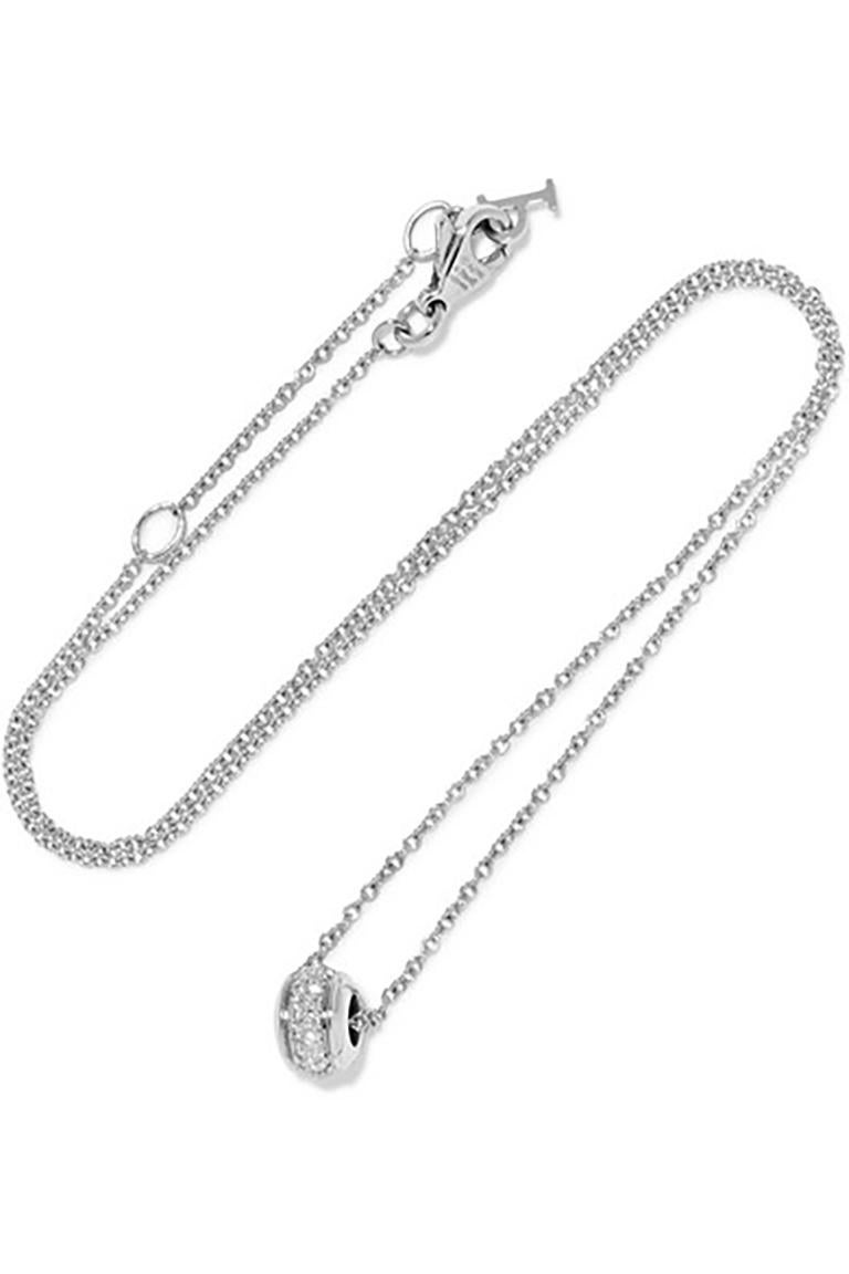 Piaget pendant in 18 karat white gold pendant necklace from the Possession Collection. Elegant turning band with one row pavé set diamonds, on a fine chain with adjustable length; 15