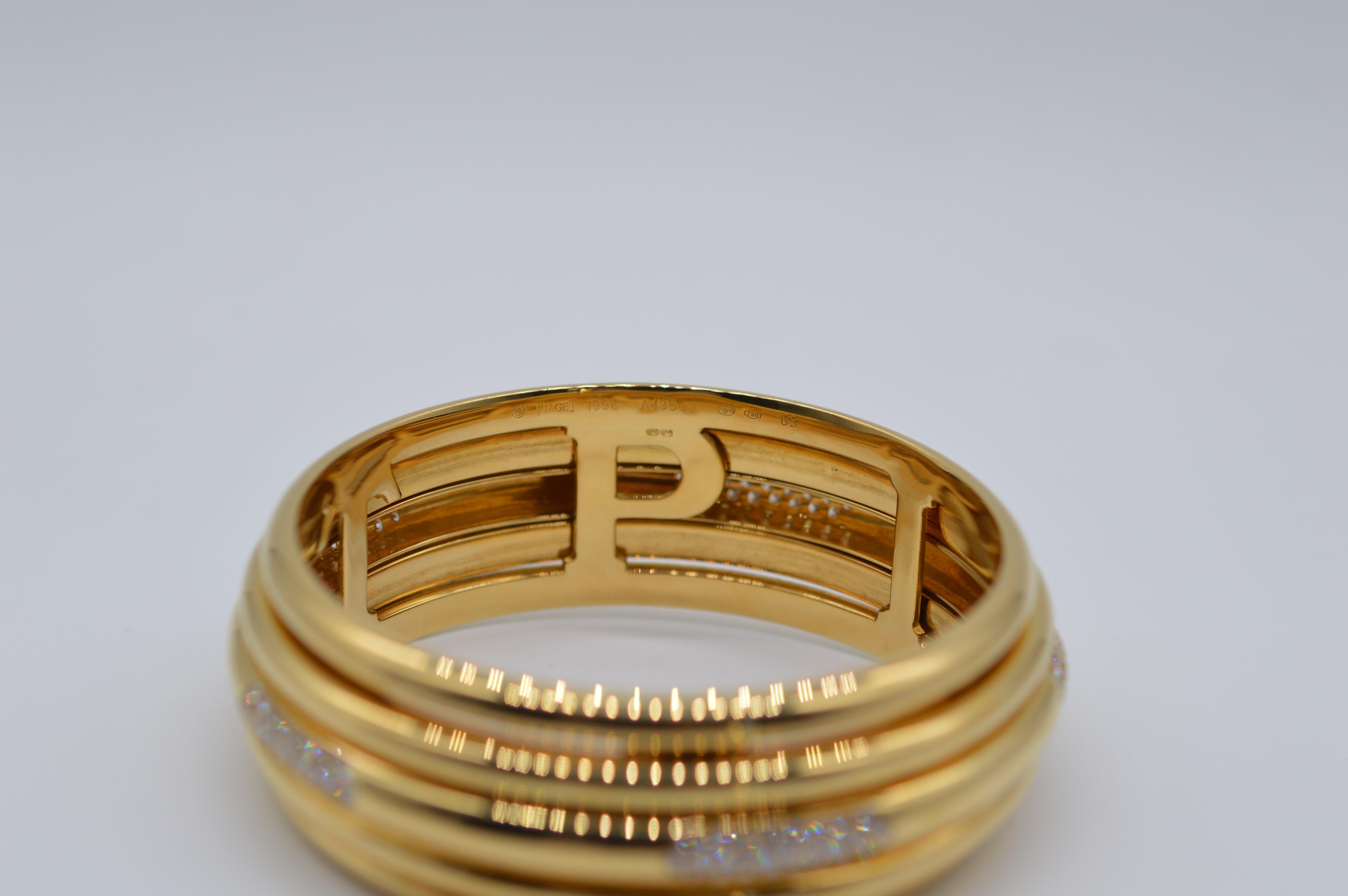 Piaget Possession Spinning Bangle Unworn
Size 65
18K Yellow Gold
Spinning bangle
Weight 124.2 grams
Diamonds Setting
Set with 125 Diamonds for a total weight of 4.37 carats
Vintage unworn
From 1996

