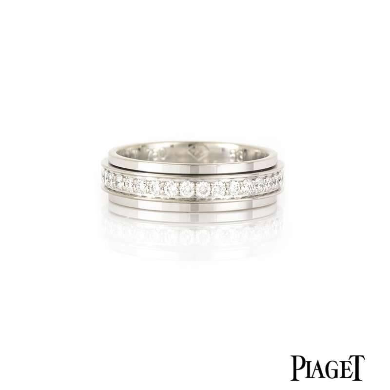 A Piaget Possession ring in 18k white gold. The 5.00mm band is set to the centre with a diamond set inner band which moves freely in a perpetual movement. The band is set with 53 round brilliant cut diamonds totalling 0.56ct, the colour is