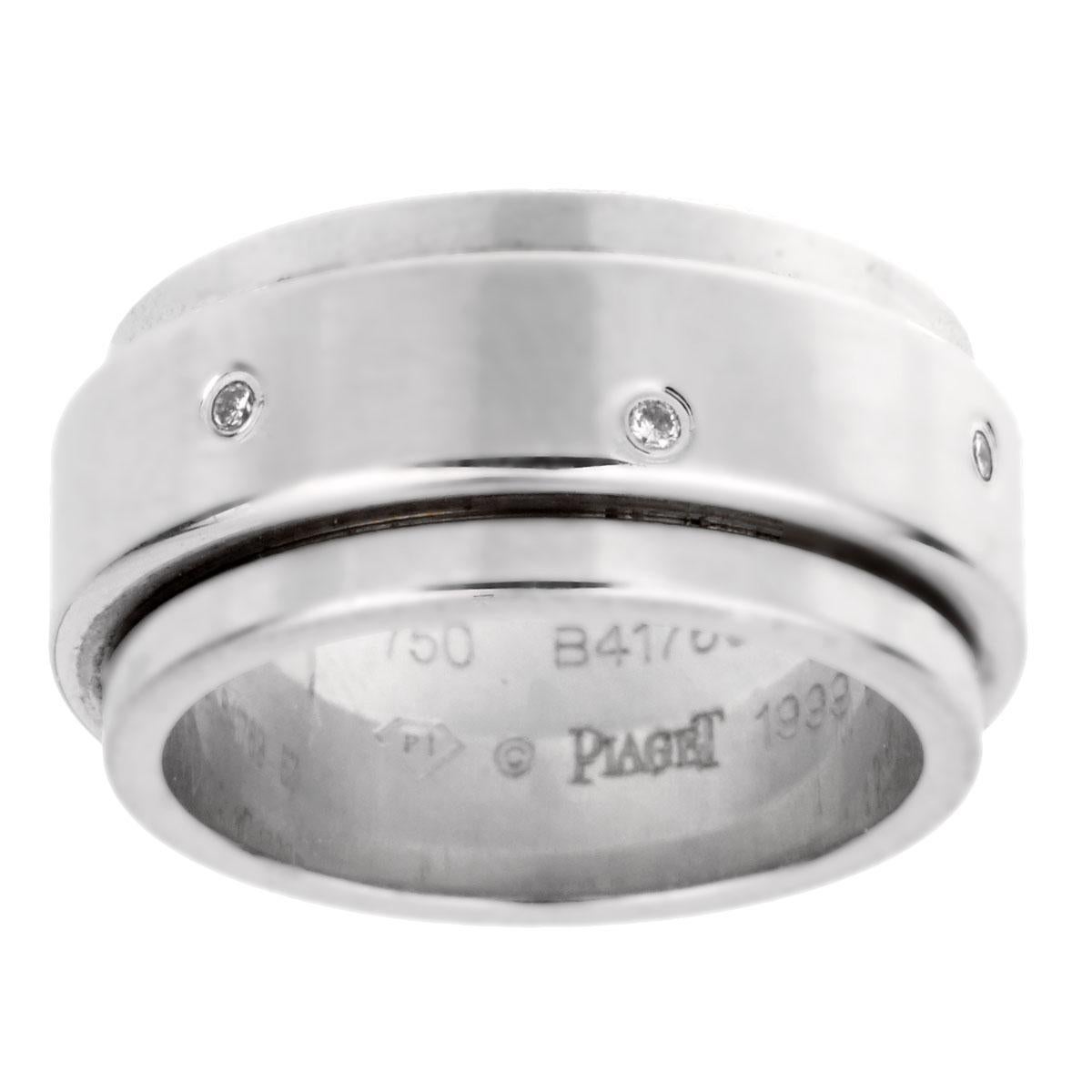 An iconic Piaget Possession ring, the center band freely spins and is set with 7 round brilliant cut diamonds in 18k white gold. The ring measures a size 8

Sku: 1908