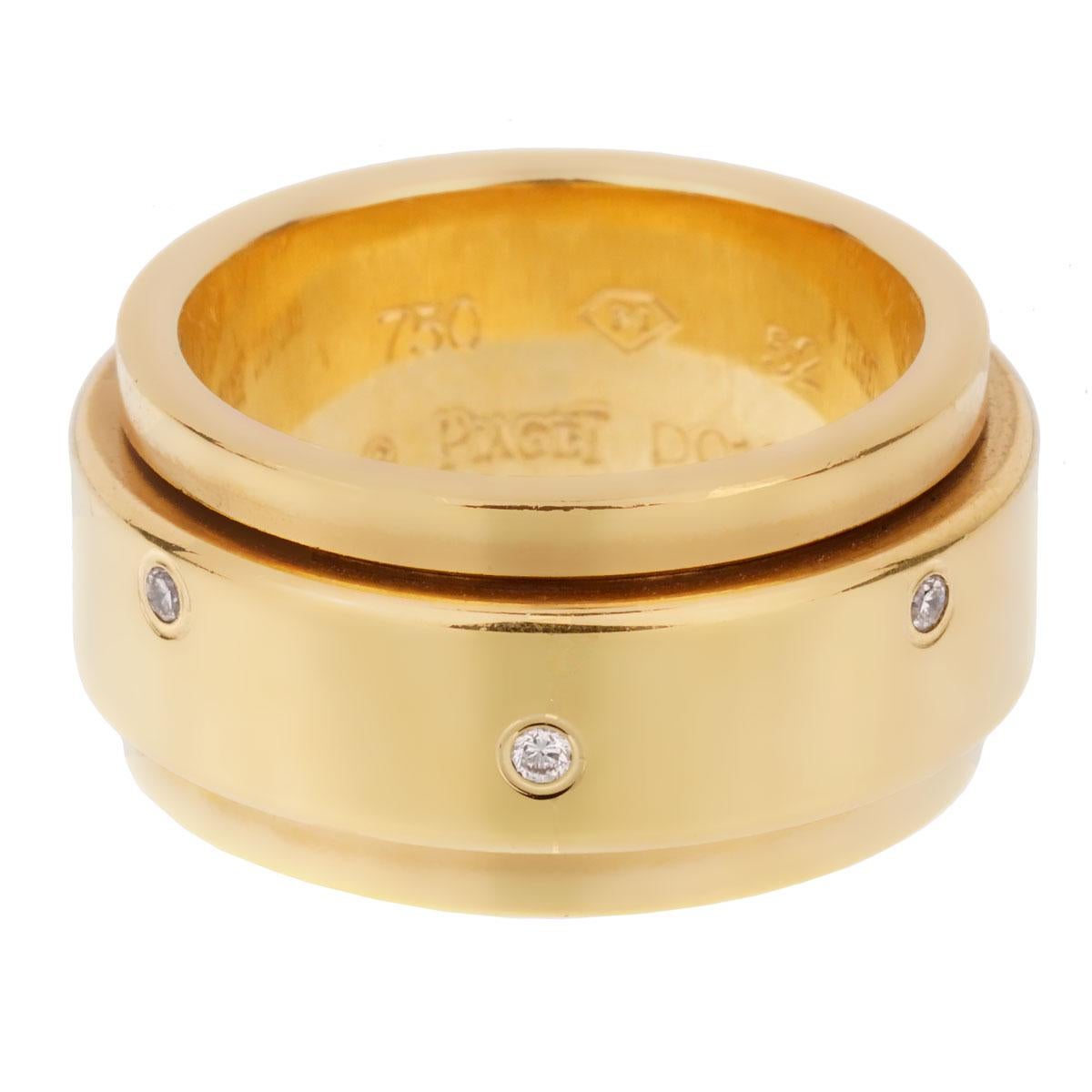 An iconic Piaget Possession ring, the center band freely spins and is set with 7 round brilliant cut diamonds in 18k yellow gold. The ring measures a size 6 1/2

Sku: 1915