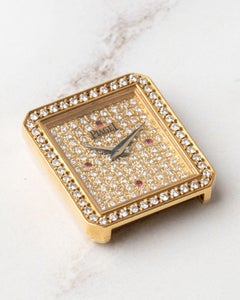 Piaget Protocole 83545 Ladies Pave Diamonds and Ruby Dial 18k YG 1980s