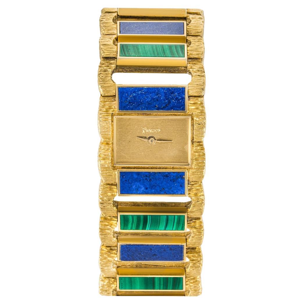 Piaget Rare montre vintage en or jaune sertie de lapis-lazuli et malachite