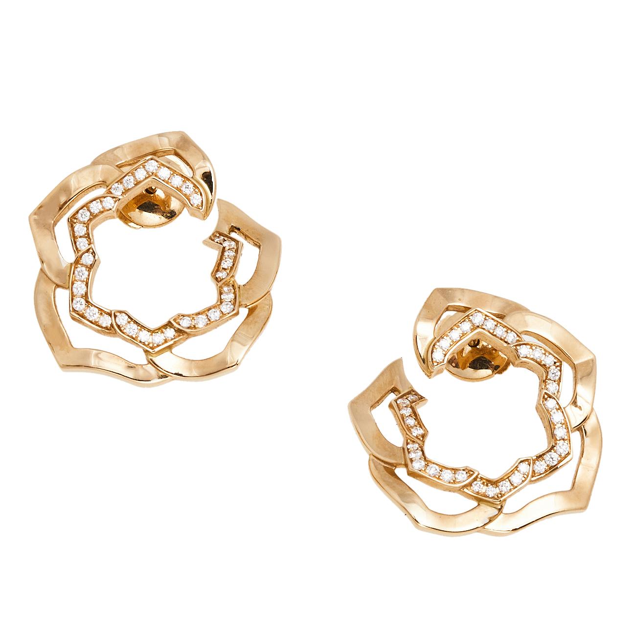 Reflecting Piaget’s exquisite craftsmanship, this pair of 18k rose gold earrings are designed as rose motifs. They are intricately designed with diamond embellishments. Screw fastenings let these beauties sit safely on your ears.

Includes: Original
