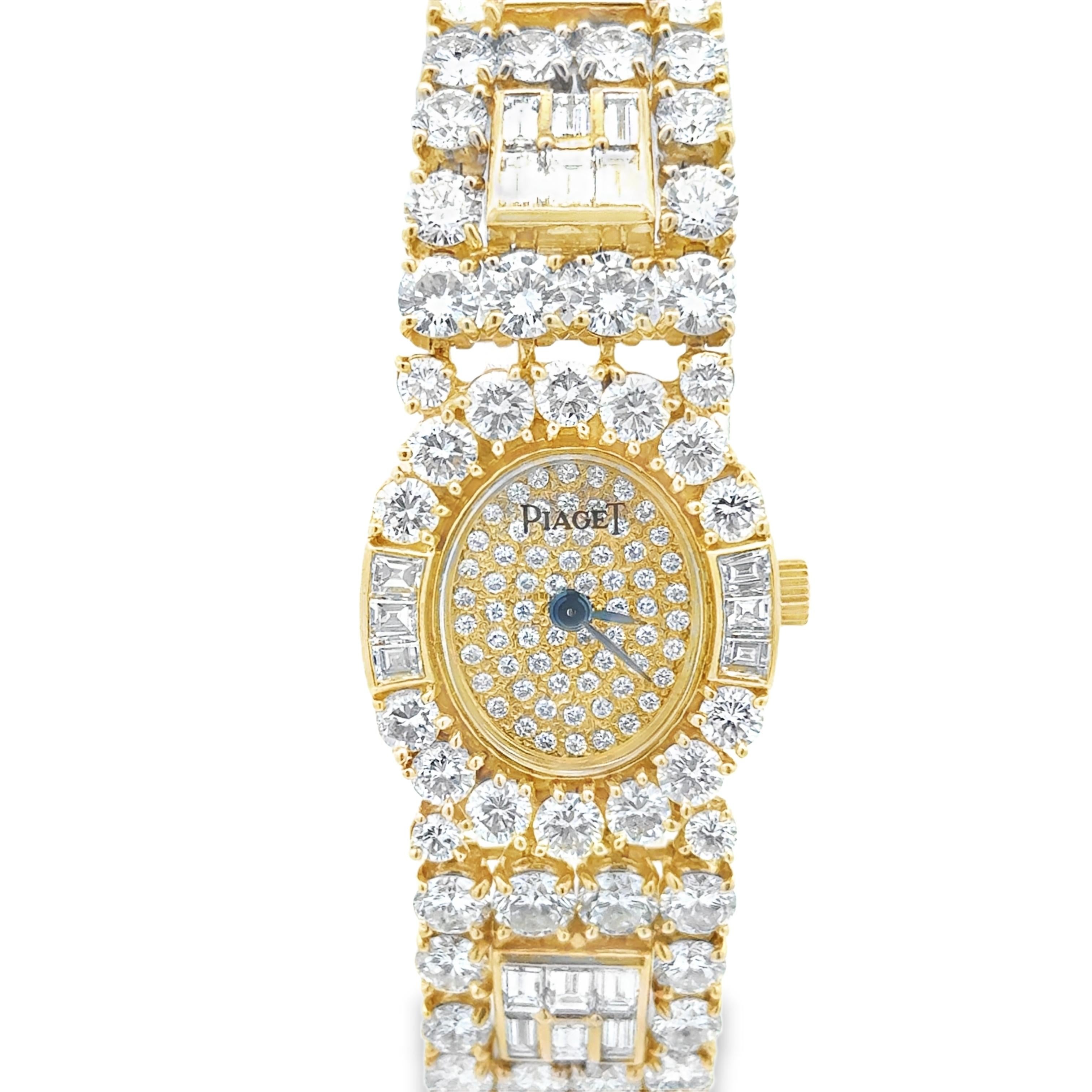 An exquisite ladies' watch created by Piaget, featuring a diamond encrusted oval shape dial accented by a halo of round and baguette cut diamonds. The bracelet is further adorned with even more diamonds, making this watch the perfect accessory for a