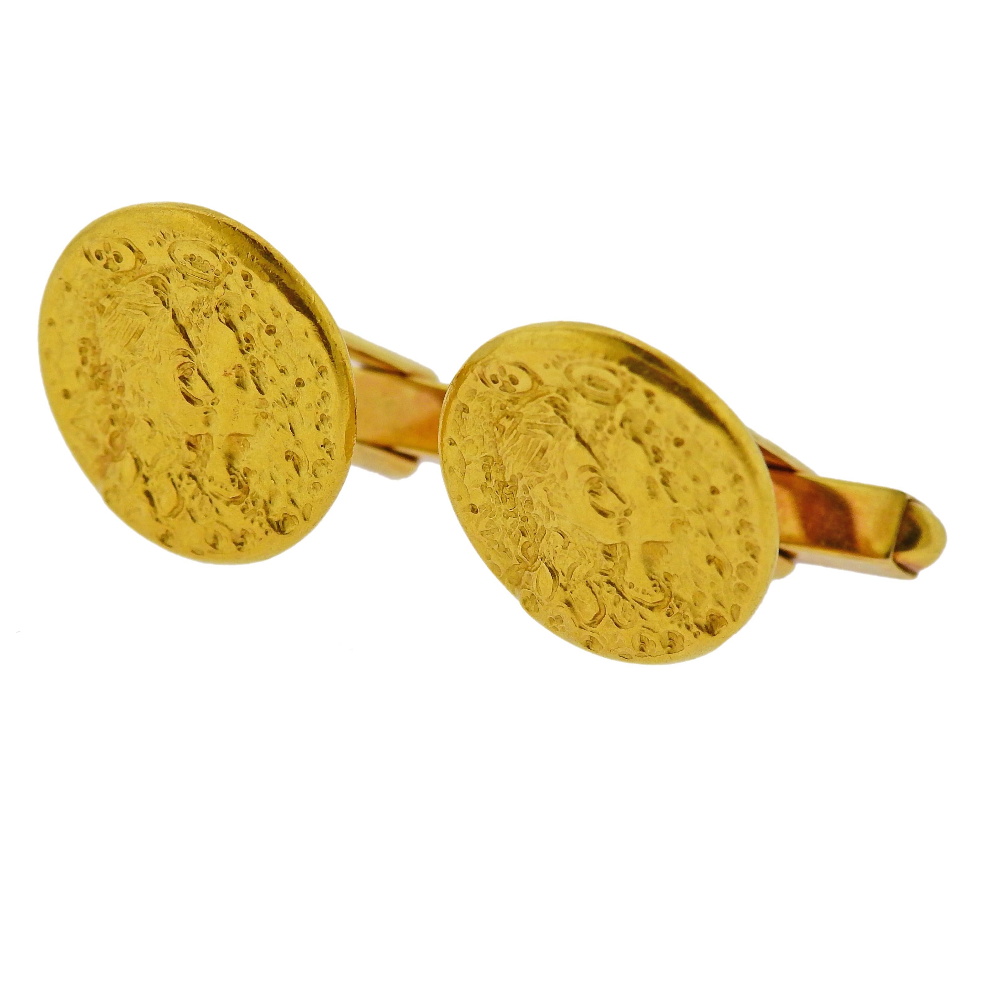 Pair of 18k yellow gold Piaget cufflinks, depicting Salvador Dali. Cufflink top is 19mm in diameter.  Weigh 21.3 grams. Marked: Piaget, 750.