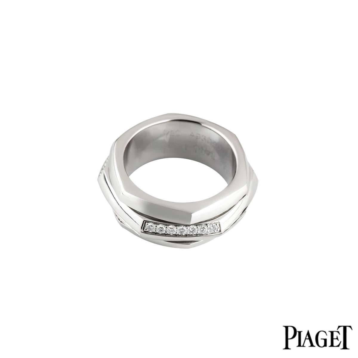 An 18k white gold diamond set Possession ring by Piaget. The ring is of hexagonal design with a spinning centre, complimented with alternating pave set round brilliant cut diamond intersections, totalling approximately 0.65ct. The ring is 9mm in