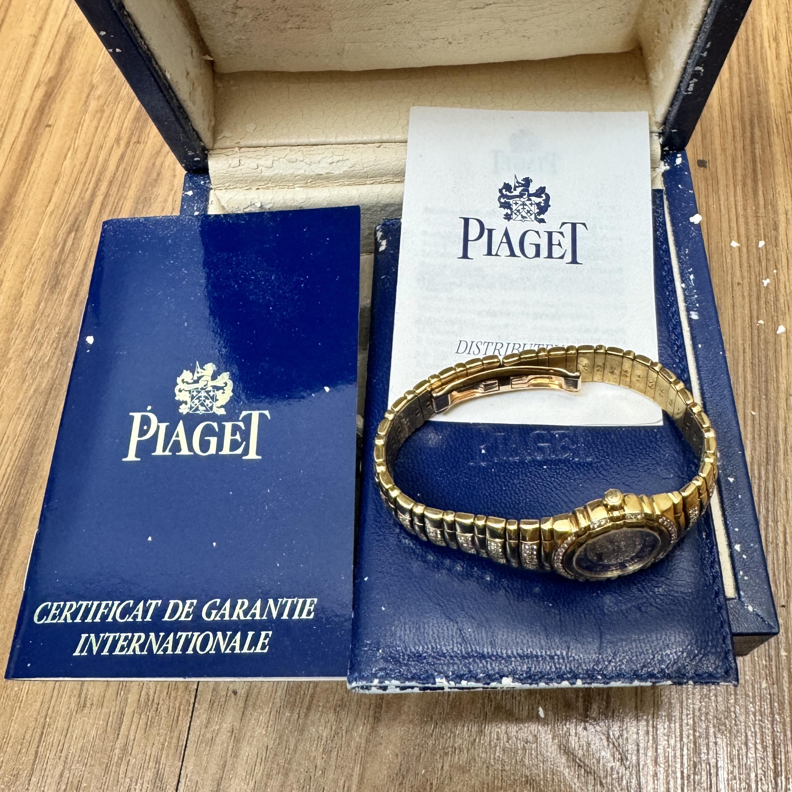 Vintage Pre-owned Piaget Tanagra Lapis Lazuli and Diamond Dial quartz watch in 18K yellow gold featuring a 25mm round case with diamond-set bezel, with Roman numerals, and integral bracelet with over 100 diamonds totaling approximately 2.25 carats.